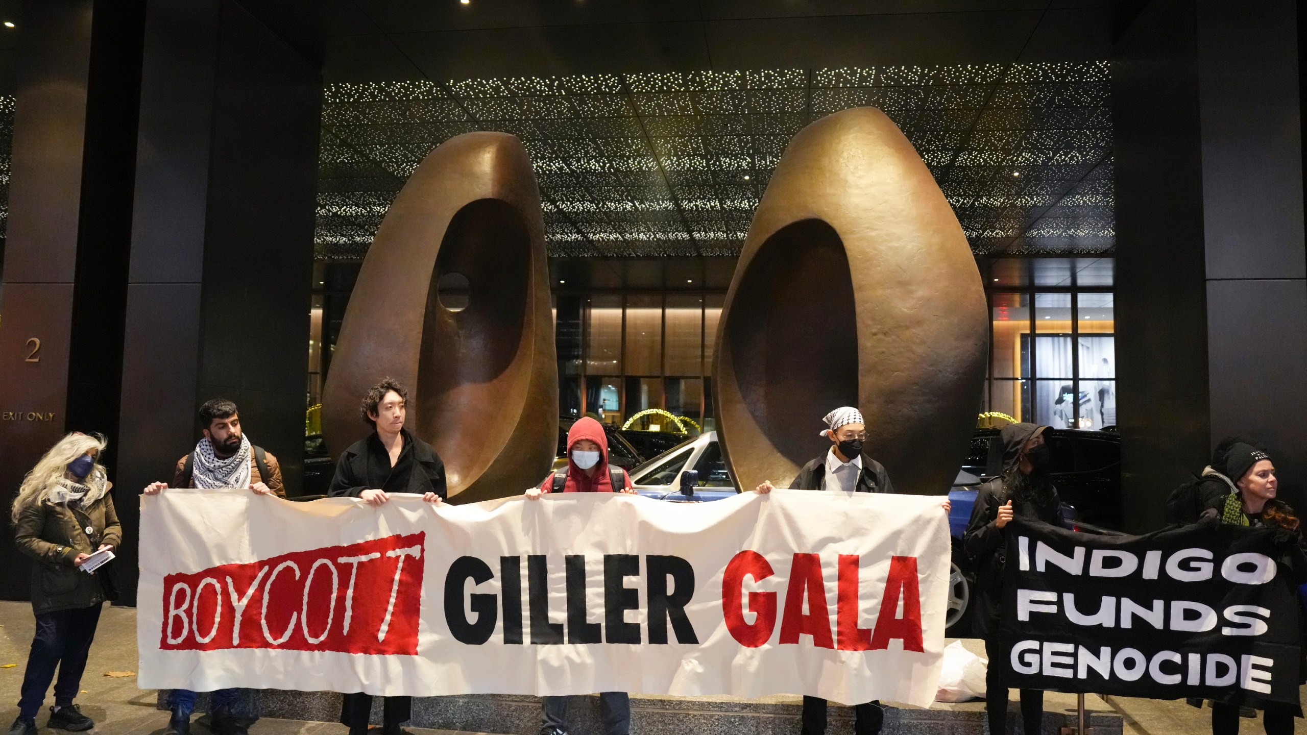 Protesters form a picket line outside the venue where the Giller Prize award ceremony is taking place, in Toronto, Monday, Nov. 18, 2024. (Chris Young/The Canadian Press via AP)