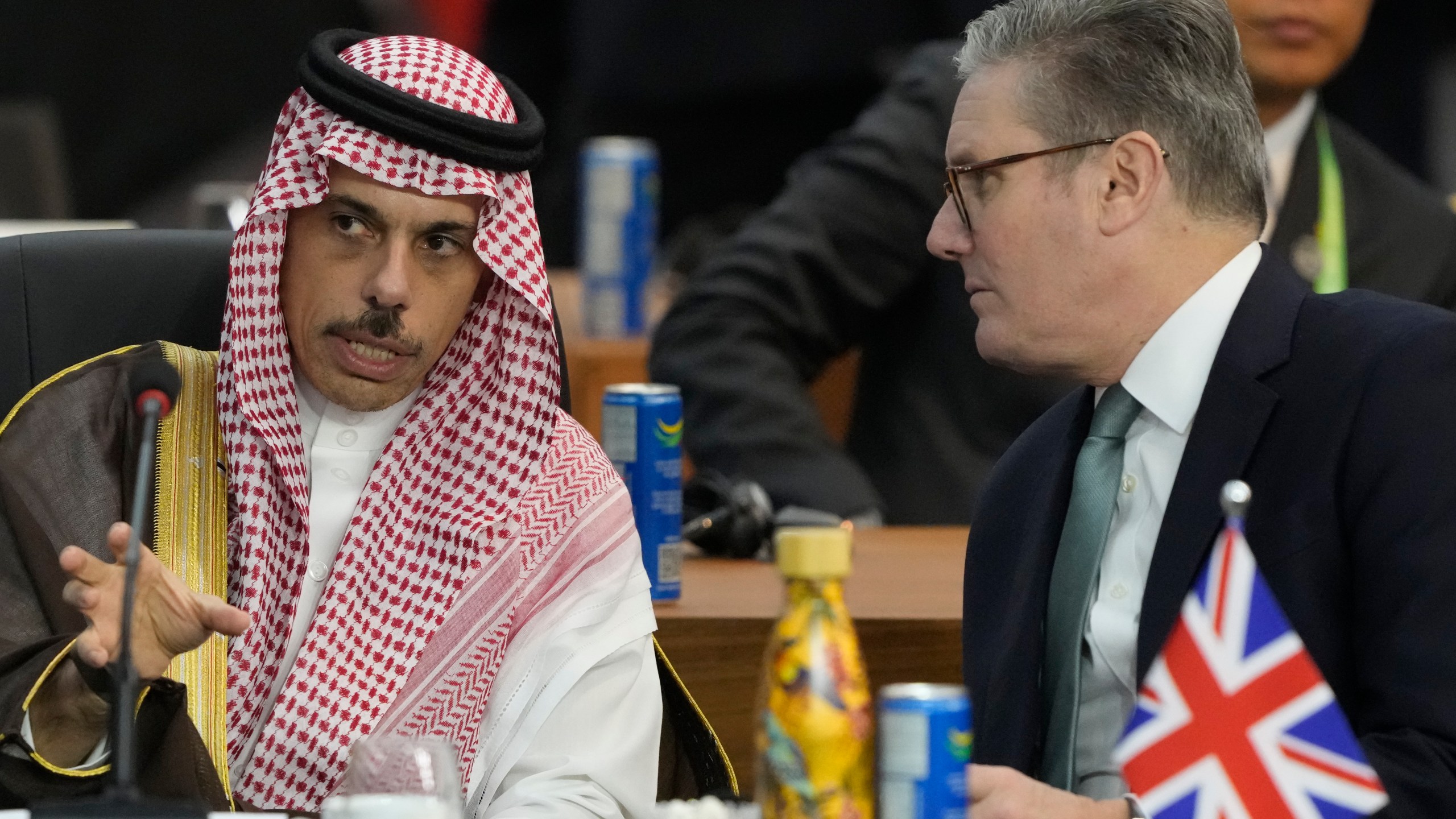 Britain's Prime Minister Keir Starmer, right, and Saudi Arabia's Foreign Minister Prince Faisal bin Farhan Al-Saud talk during the G20 Summit leaders meeting in Rio de Janeiro, Monday, Nov. 18, 2024. (AP Photo/Eraldo Peres)