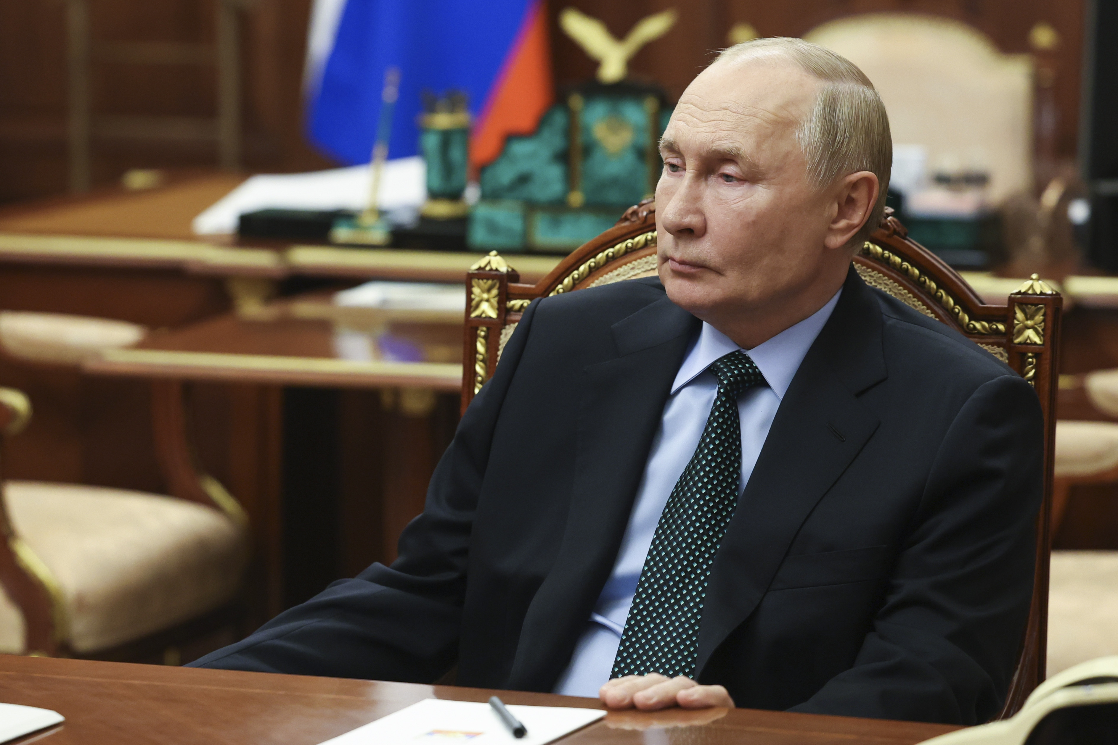 Russian President Vladimir Putin listens to Moscow-appointed head of Russian-controlled Zaporizhzhia region of Ukraine, Yevgeny Balitsky during their meeting at the Kremlin in Moscow, Russia, Monday, Nov. 18, 2024. (Vyacheslav Prokofyev, Sputnik, Kremlin Pool Photo via AP)