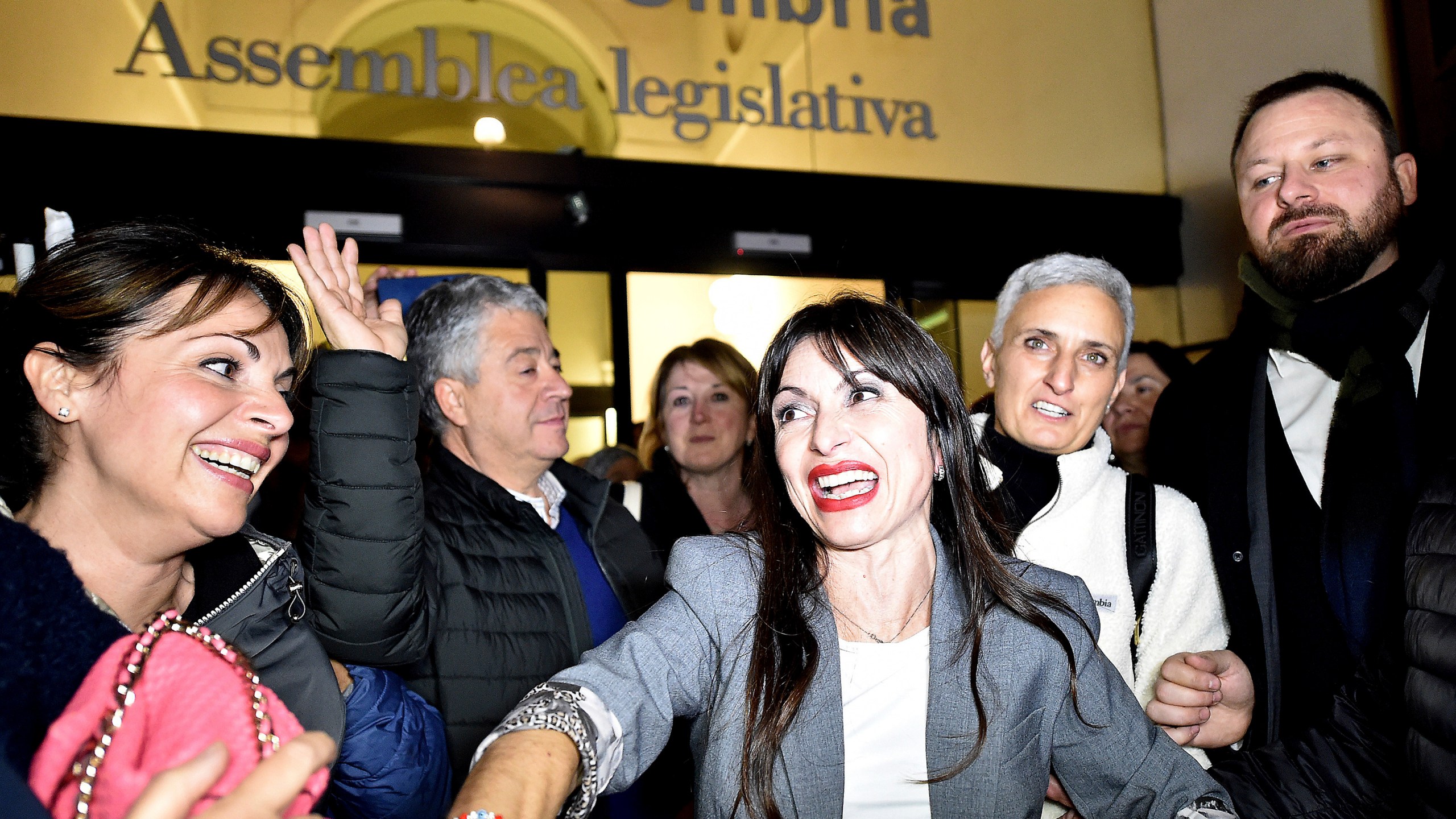 Center-left candidate Stefania Proietti, center, celebrates following regional elections in the region of Umbria, in Perugia, Italy, late Monday, Nov. 18, 2024. (Roberto Settonce/LaPresse via AP)