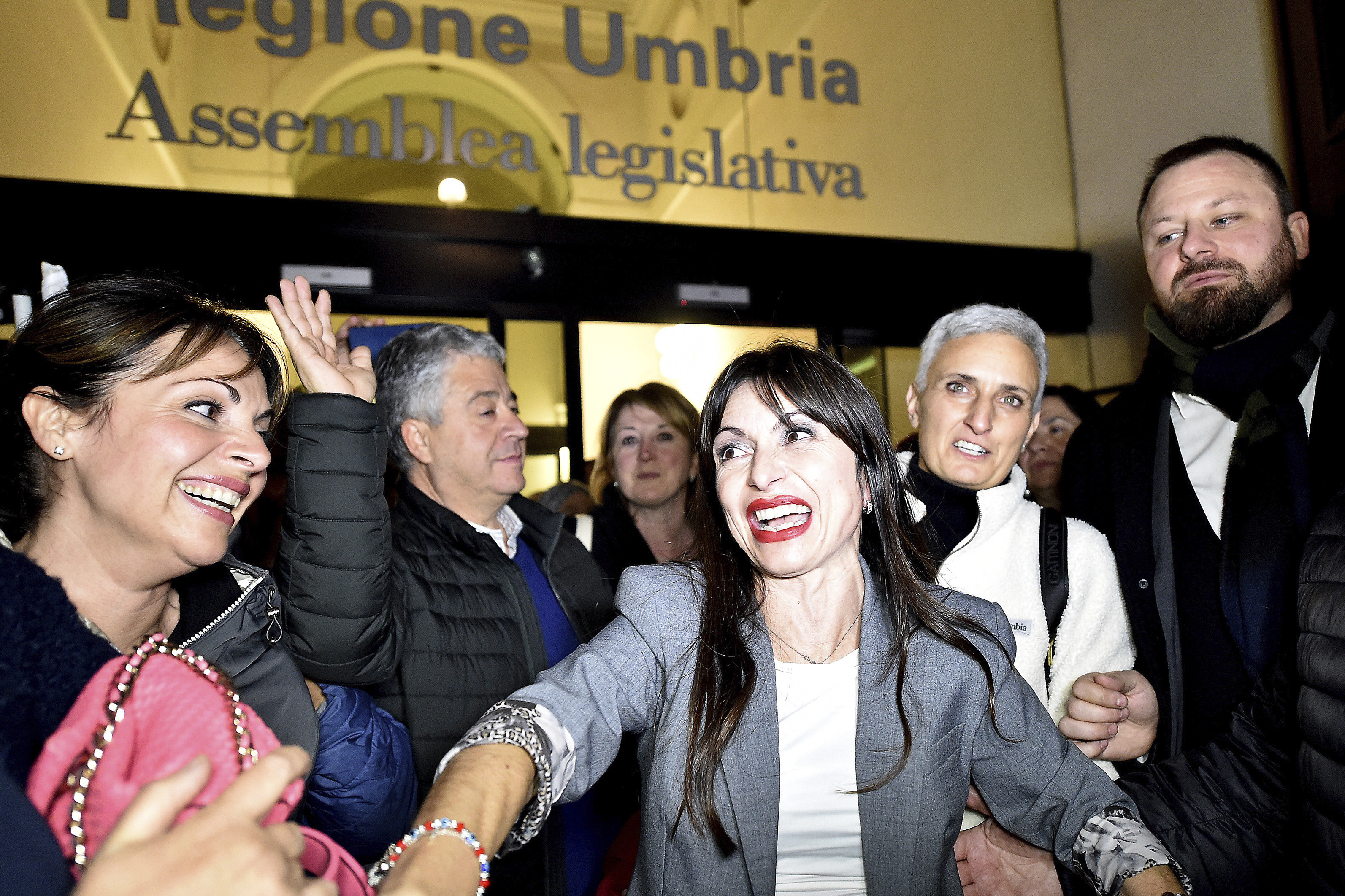 Center-left candidate Stefania Proietti, center, celebrates following regional elections in the region of Umbria, in Perugia, Italy, late Monday, Nov. 18, 2024. (Roberto Settonce/LaPresse via AP)