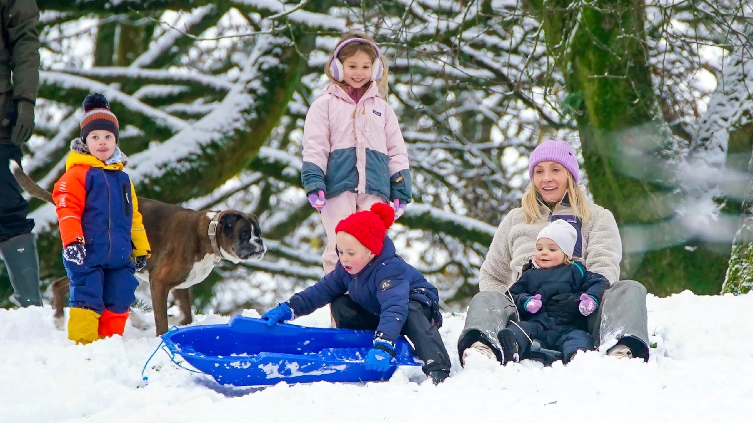 People play in the snow on the hills of Buxton, Derbyshire, Britain, Tuesday, Nov. 19, 2024. (Peter Byrne/PA via AP)