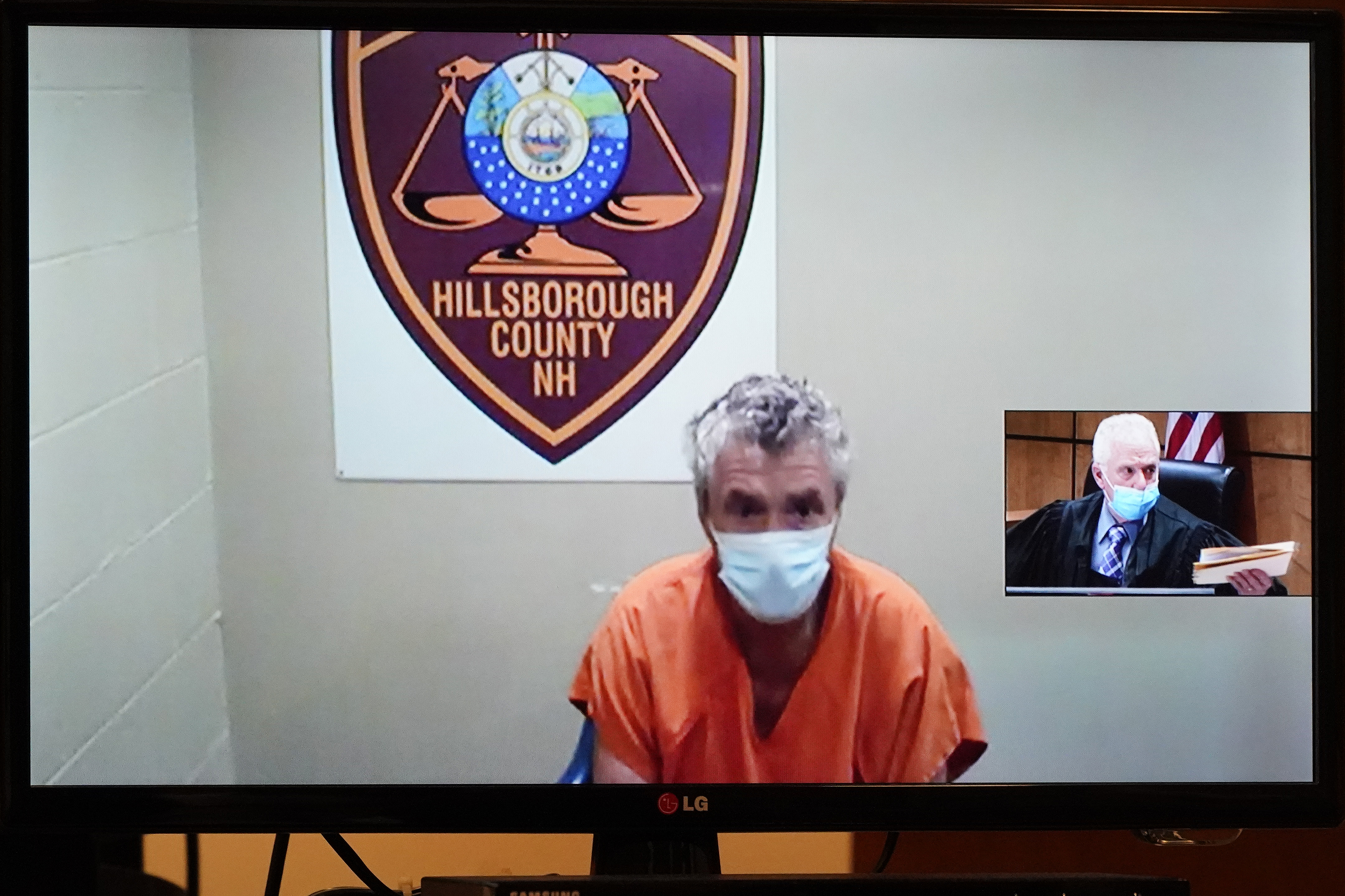 FILE - Bradley Asbury is arraigned via video as Judge William Lyons presides, at right, at Manchester, N.H., April 8, 2021. (AP Photo/Elise Amendola, Pool, File)