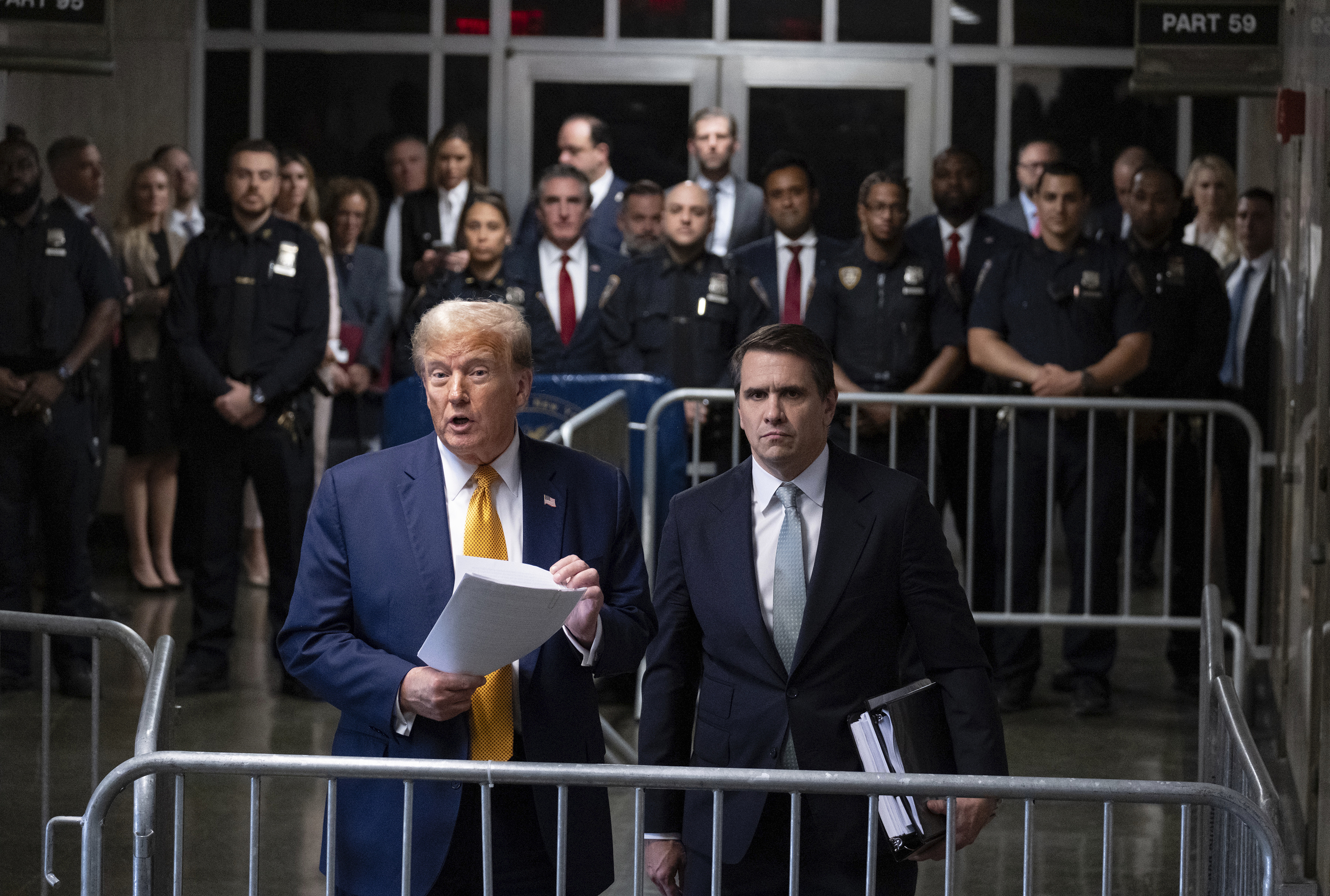 Former President Donald Trump, standing with defense attorney Todd Blanche, speaks at the conclusion of proceedings for the day at his trial at Manhattan criminal court, Tuesday, May 14, 2024, in New York. (AP Photo/Craig Ruttle, Pool)