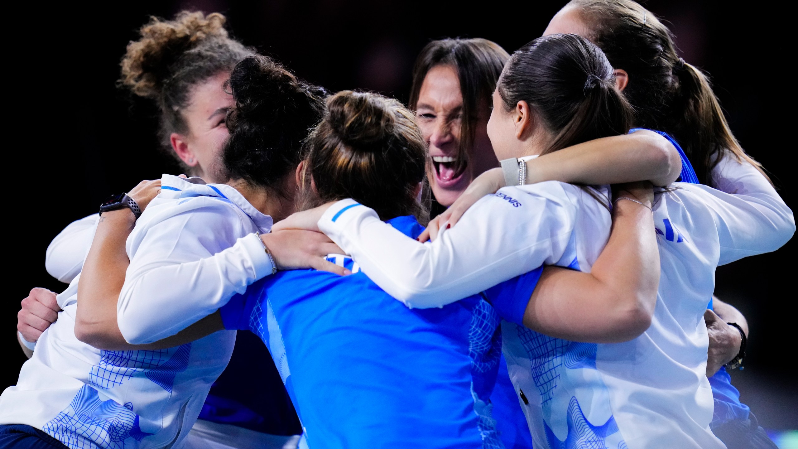 Italy tennis players celebrate after winning against Slovakia the Billie Jean King Cup final at the Martin Carpena Sports Hall in Malaga, southern Spain, on Wednesday, Nov. 20, 2024. (AP Photo/Manu Fernandez)