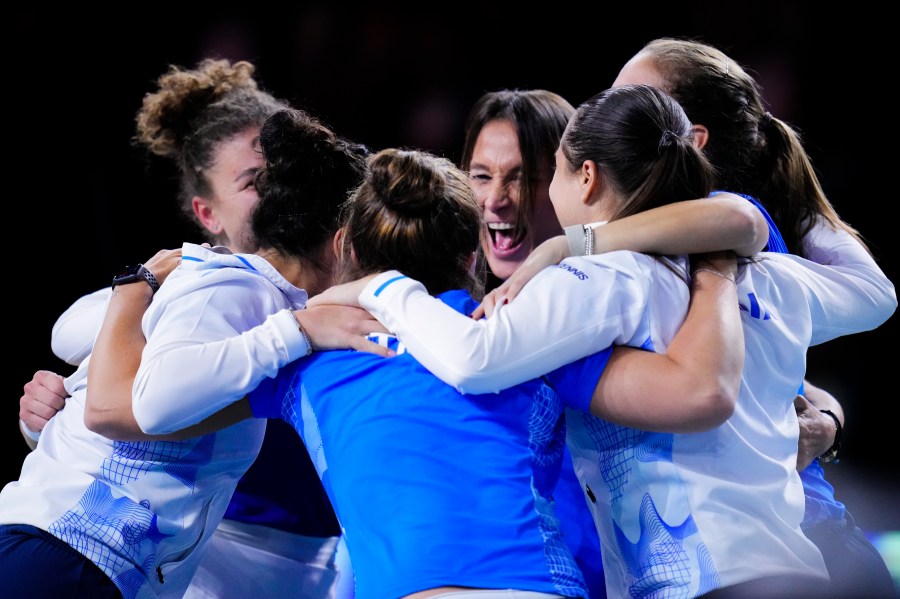 Italy tennis players celebrate after winning against Slovakia the Billie Jean King Cup final at the Martin Carpena Sports Hall in Malaga, southern Spain, on Wednesday, Nov. 20, 2024. (AP Photo/Manu Fernandez)