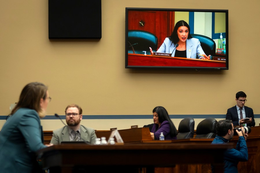 Rep. Alexandria Ocasio-Cortez, D-N.Y., seen on video screen, addresses Administrator of the Federal Emergency Management Agency (FEMA) Deanne Criswell, left, as she testifies in front a House Committee on Oversight and Accountability hearing on oversight of FEMA, on Capitol Hill in Washington, Tuesday, Nov. 19, 2024. (AP Photo/Ben Curtis)