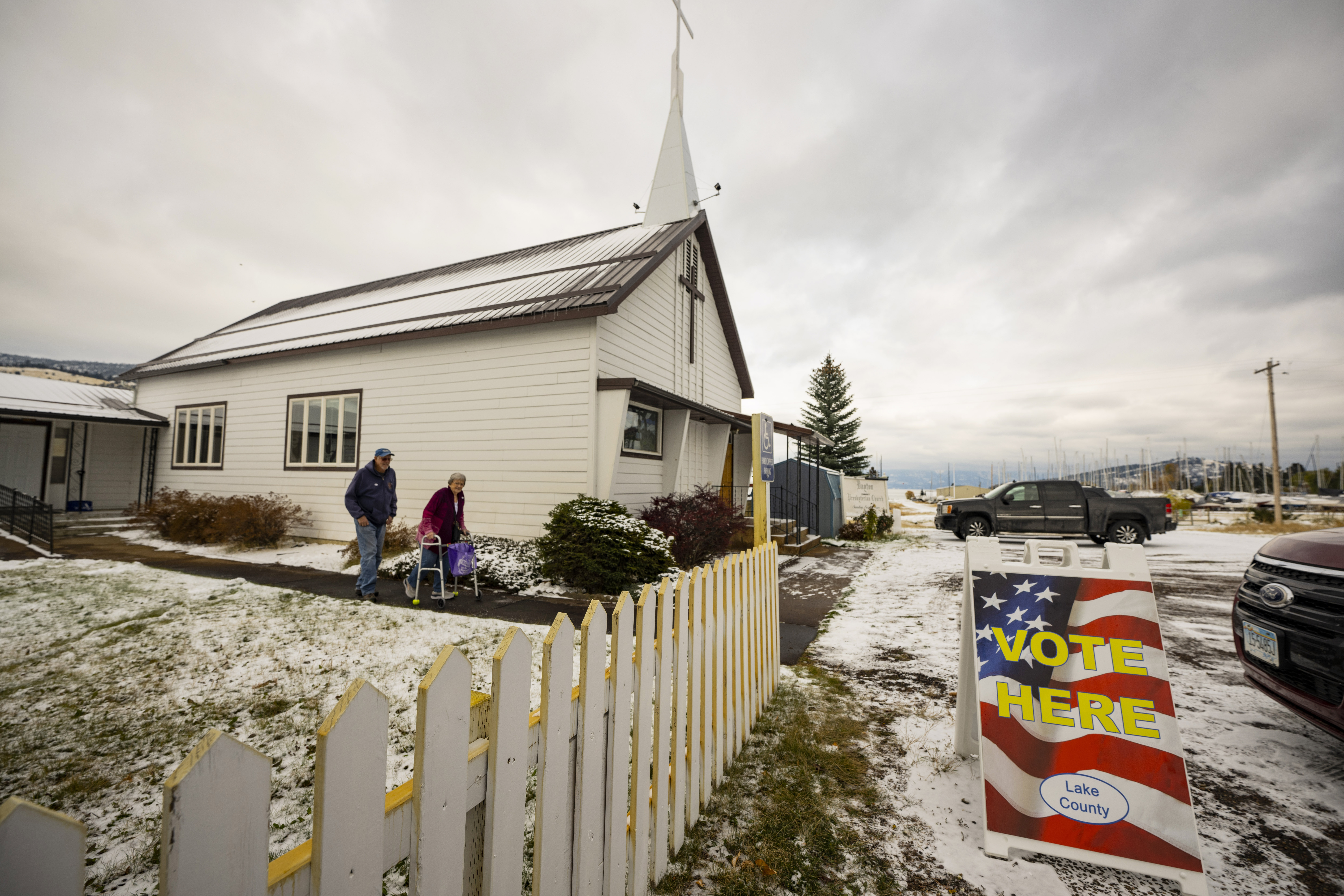 FILE - Terry and Linda Gore leave the Dayton church on the Flathead Indian Reservation after voting, Nov. 8, 2022, in Arlee, Mont. (AP Photo/Tommy Martino, File)