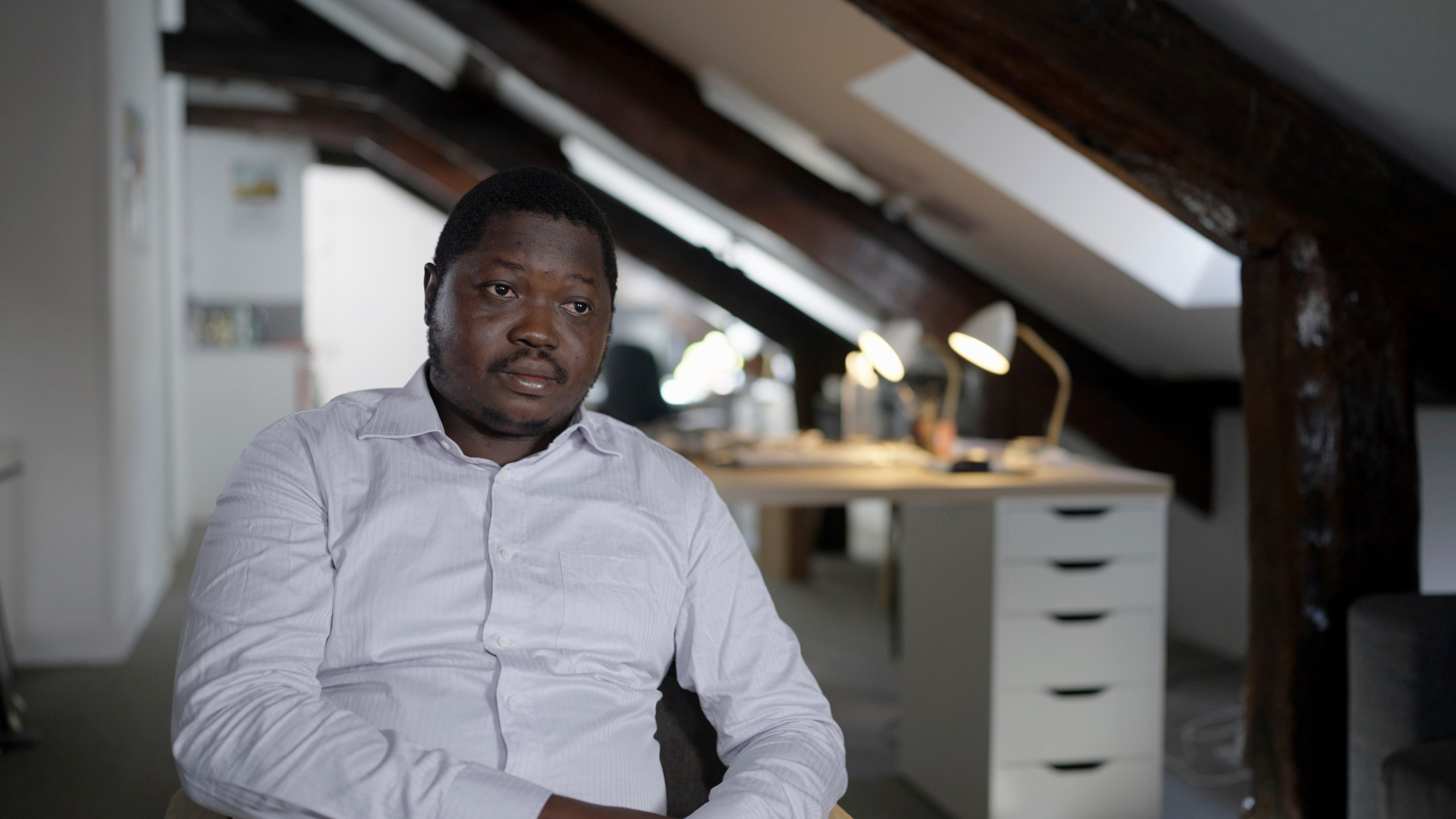 Whistleblower Ephrem Yaline-Ngonzo, who was recruited by Kremlin-backed Wagner forces to spread Russian propaganda in Central African Republic, sits for an interview in the offices of the Forbidden Stories NGO in Paris, France, Sept. 6, 2024. (Forbidden Stories via AP)