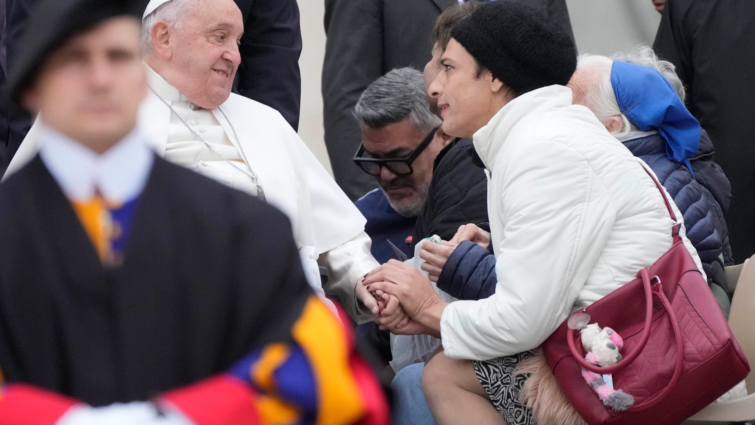 Pope Francis greets faithful during his weekly general audience in St. Peter's Square at The Vatican, Wednesday, Nov.20, 2024. (AP Photo/Gregorio Borgia)