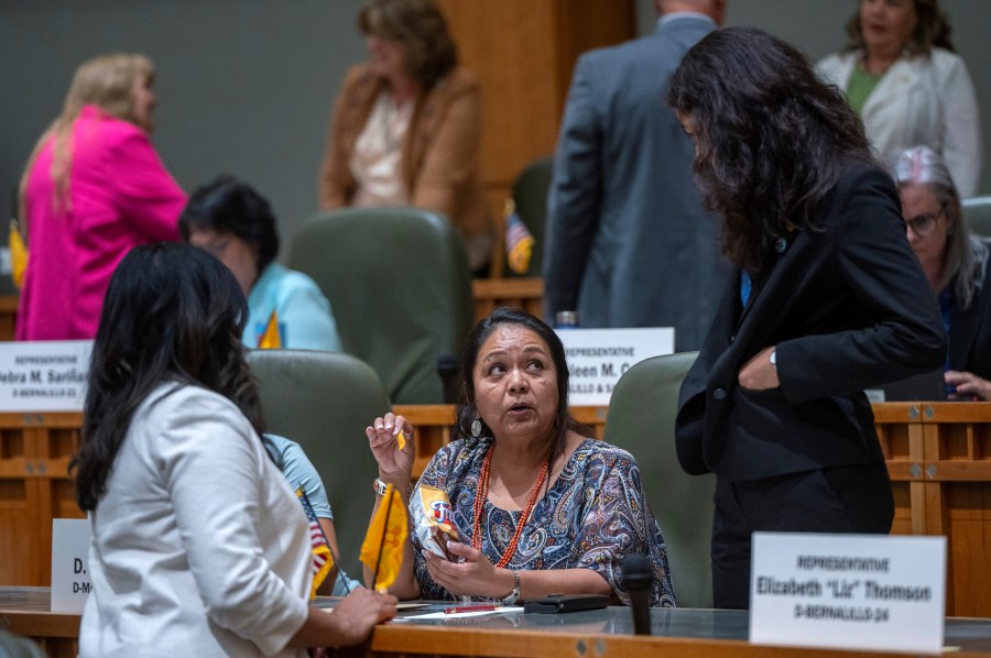 FILE - House Maj. Whip Reena Szczepanski, D-Santa Fe, left, Rep. D. Wonda Johnson, D-Church Rock, center, and Rep. Cristina Parajon, D-Albuquerque, talk before the start of a special session, in Santa Fe, N.M., July 18, 2024. (Eddie Moore/The Albuquerque Journal via AP, File)