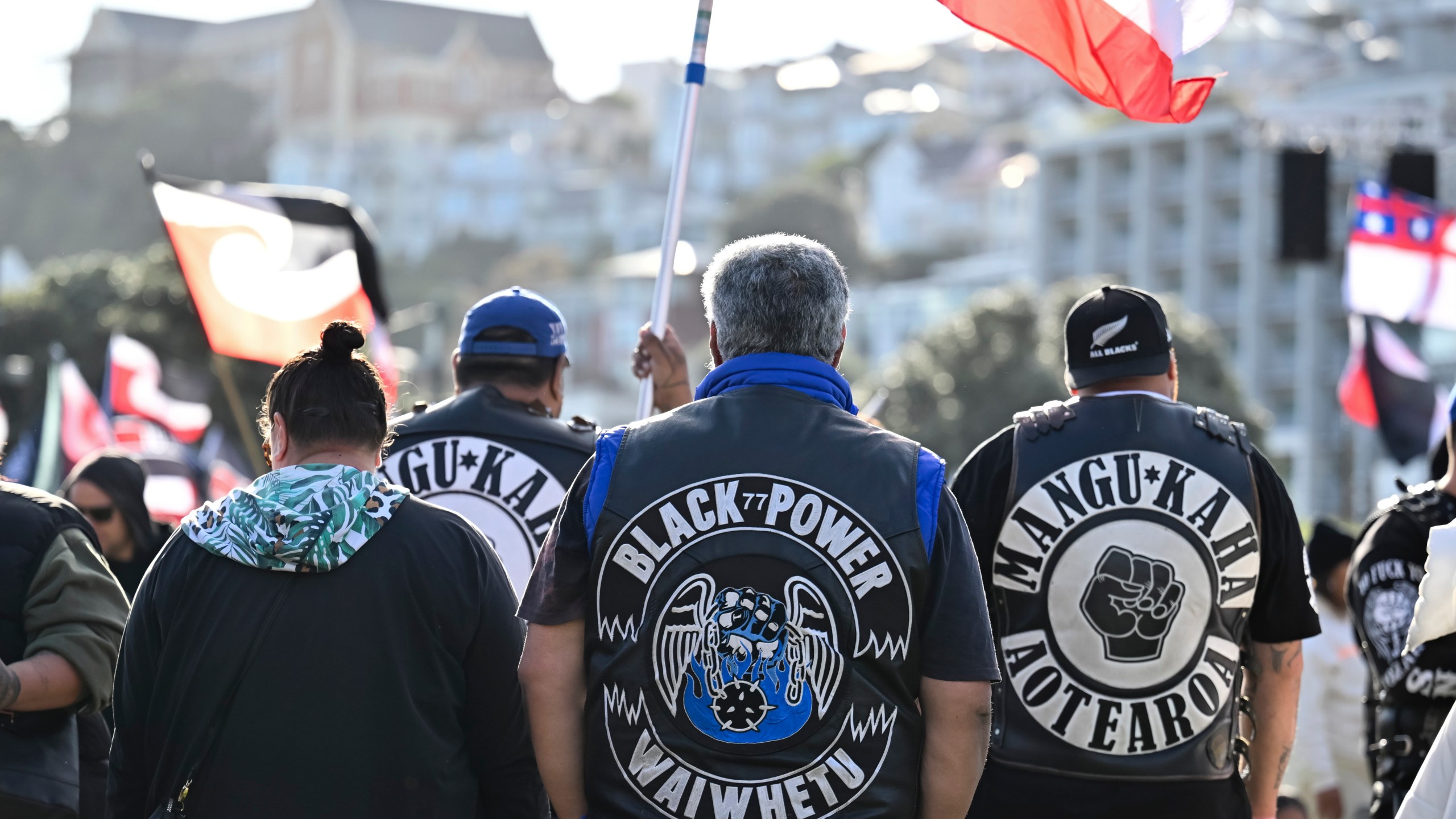 Members of patched gangs gather before marching to parliament during a protest against a proposed law that would redefine the country's founding agreement between Indigenous Māori and the British Crown, in Wellington, New Zealand, Tuesday, Nov. 19, 2024. (AP Photo/Mark Tantrum)