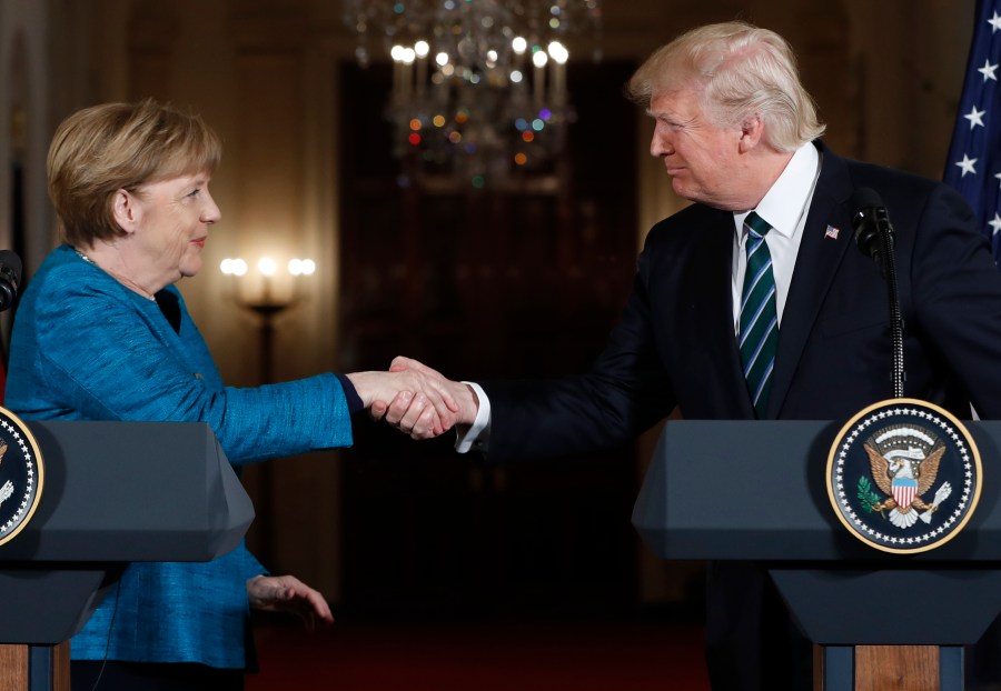 FILE - President Donald Trump and German Chancellor Angela Merkel shake hands following their joint news conference in the East Room of the White House in Washington, Friday, March 17, 2017. (AP Photo/Pablo Martinez Monsivais, File)