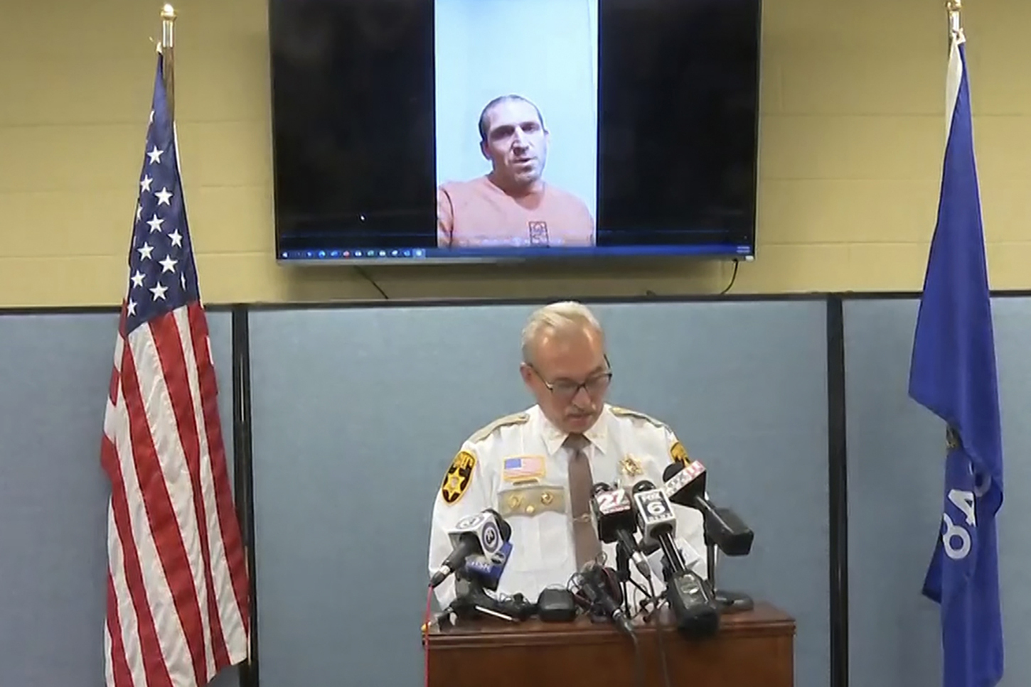 This still image provided by Green Lake County Sheriff's Office, Sheriff Mark Podoll holds a news conference regarding Ryan Borgwardt, who faked his own drowning this summer on Thursday, Nov. 21, 2024 in Green Lake, Wis. (Green Lake County Sheriff's Office via AP)