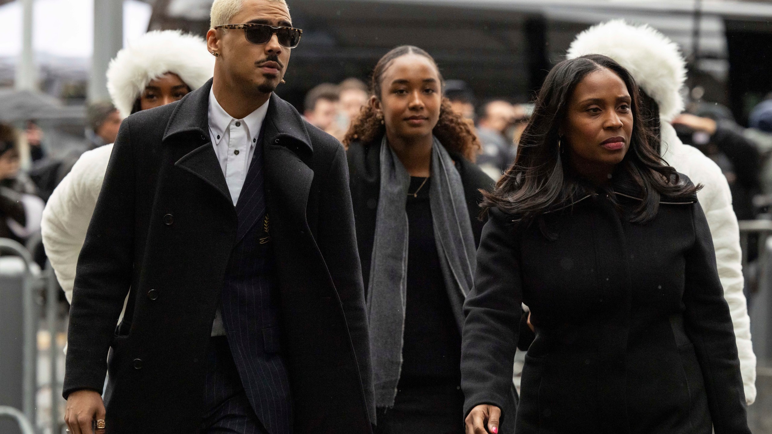 Quincy Brown, left, stepson of Sean "Diddy Combs and other family members arrive at Manhattan federal court, Friday, Nov. 22 2024, in New York. (AP Photo/Yuki Iwamura)