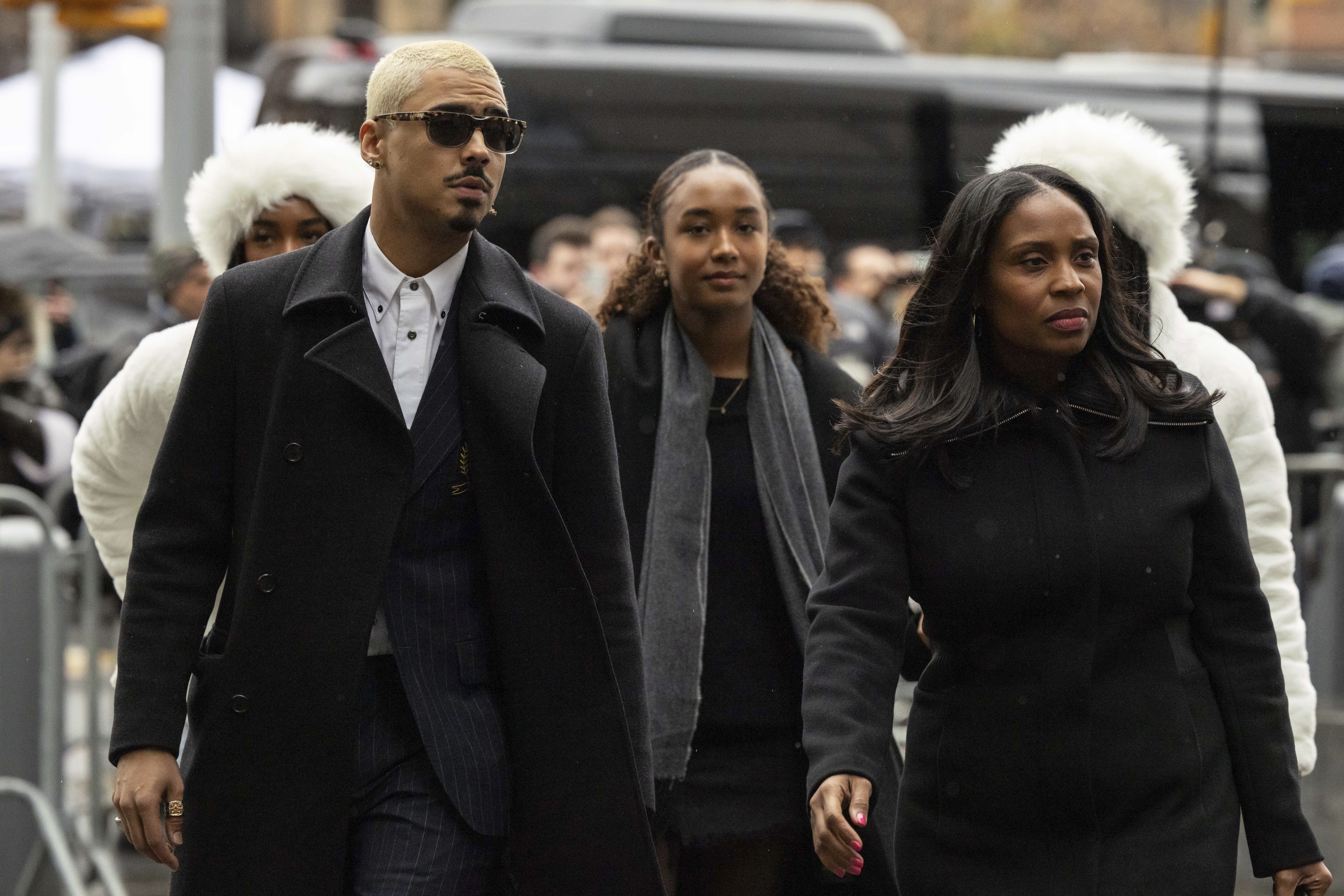 Quincy Brown, left, stepson of Sean "Diddy Combs and other family members arrive at Manhattan federal court, Friday, Nov. 22 2024, in New York. (AP Photo/Yuki Iwamura)