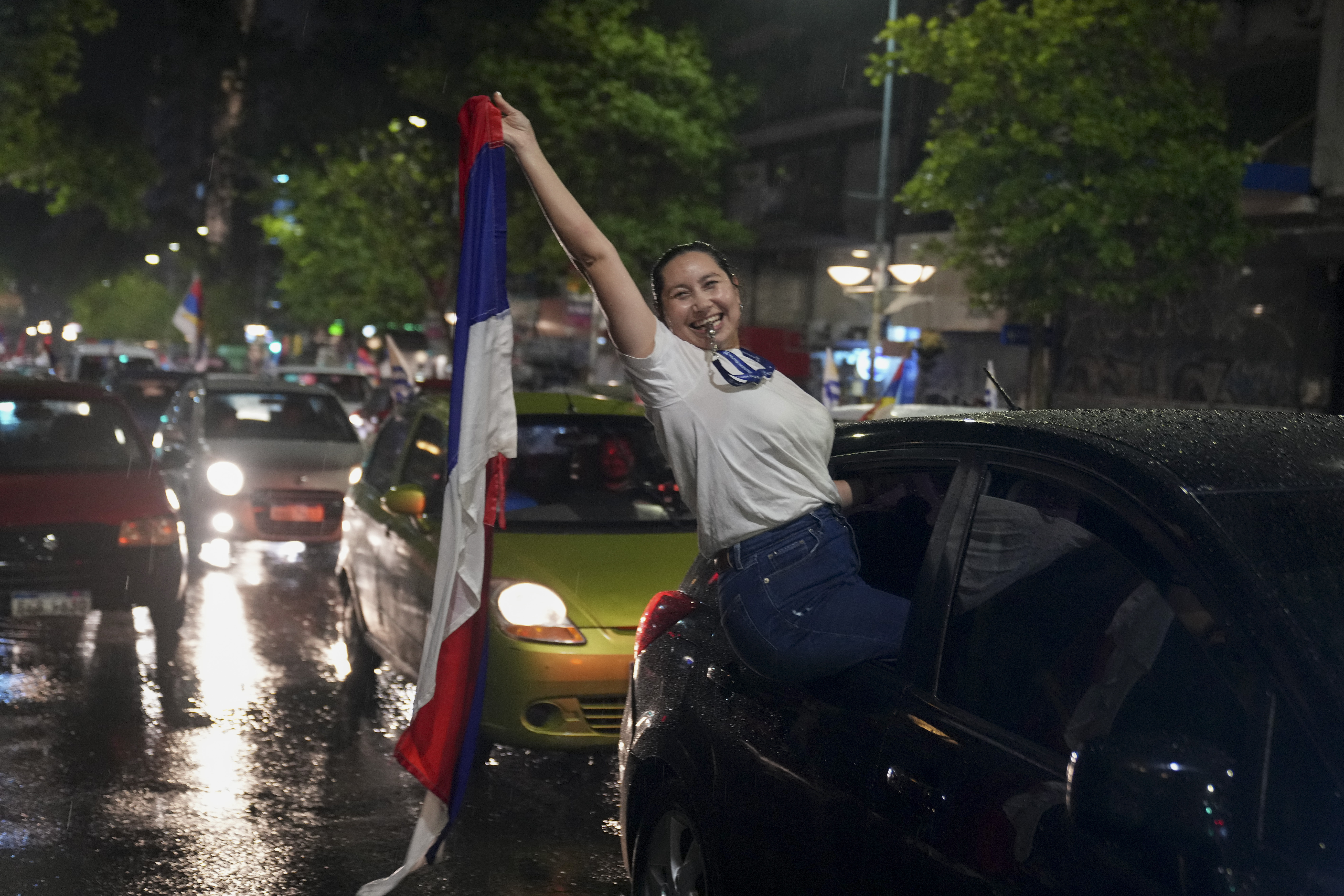 Supporters of the Broad Front (Frente Amplio) celebrate the victory of candidate Yamandú Orsi in the presidential run-off election in Montevideo, Uruguay, Sunday, Nov. 24, 2024. (AP Photo/Matilde Campodonico)