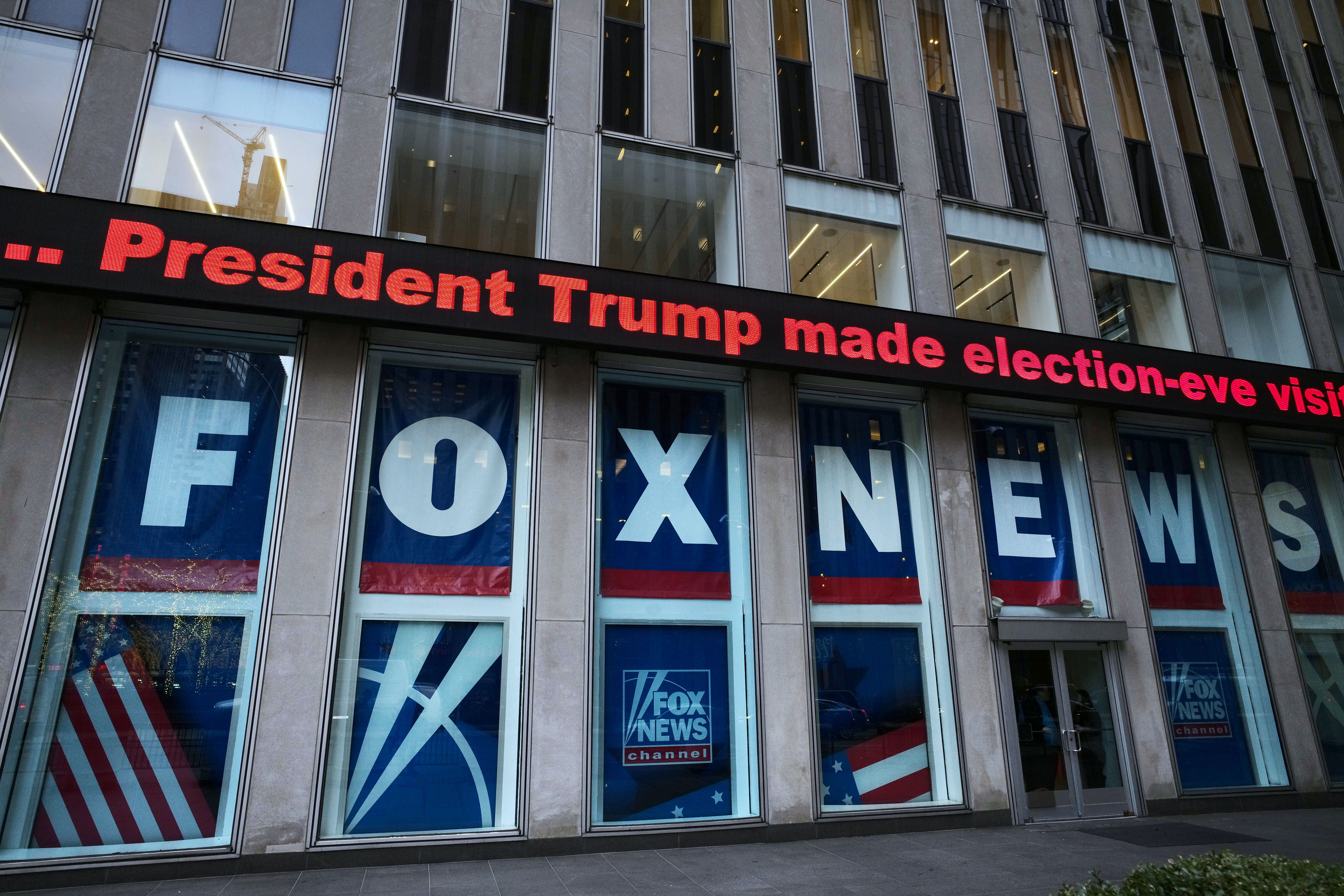 FILE - A headline about President Donald Trump is shown outside Fox News studios, Nov. 28, 2018, in New York. (AP Photo/Mark Lennihan, File)