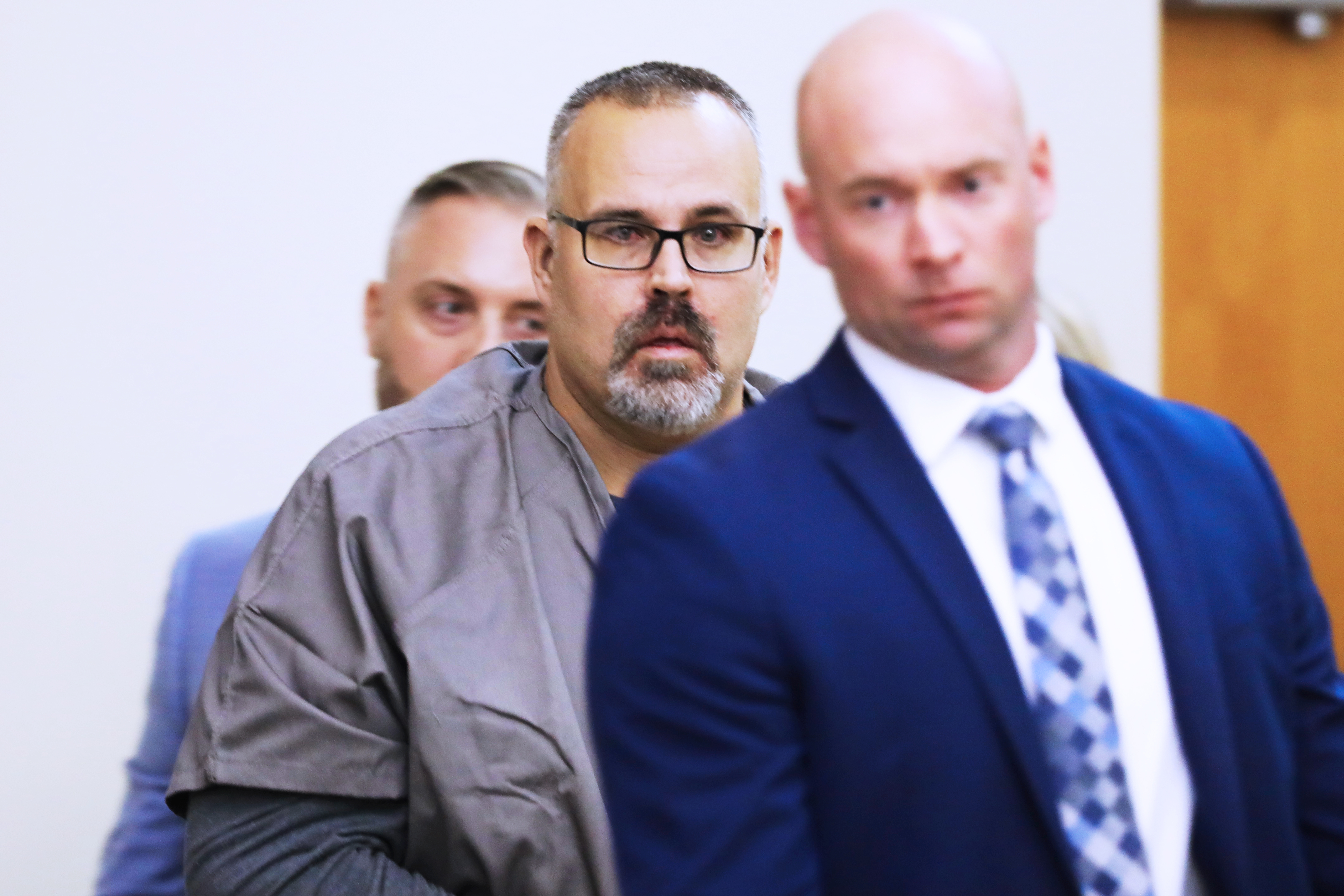 Ex-Letcher County Sheriff Shawn "Mickey" Stines in tears seeing his family as he enters a Letcher County Circuit Court courtroom on November 25, 2024, during his arraignment for the September fatal shooting of district judge Kevin Mullins in Whitesburg, Ky. (Tasha Poullard/Lexington Herald-Leader via AP)