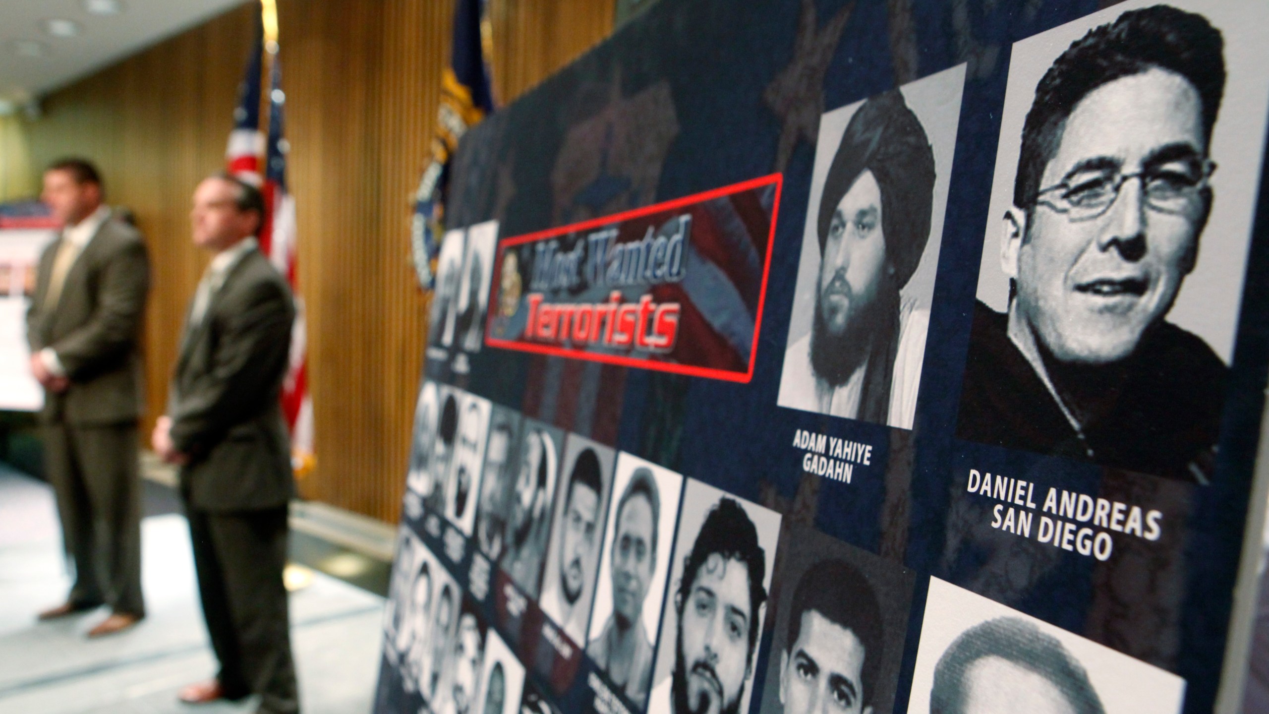 FILE - A photo of Daniel Andreas San Diego, top right, appears on a poster of the FBI's most wanted terrorists during a news conference announcing his addition to the most wanted terrorist list, Tuesday, April 21, 2009, at FBI Headquarters in Washington. (AP Photo/Haraz N. Ghanbari, File)