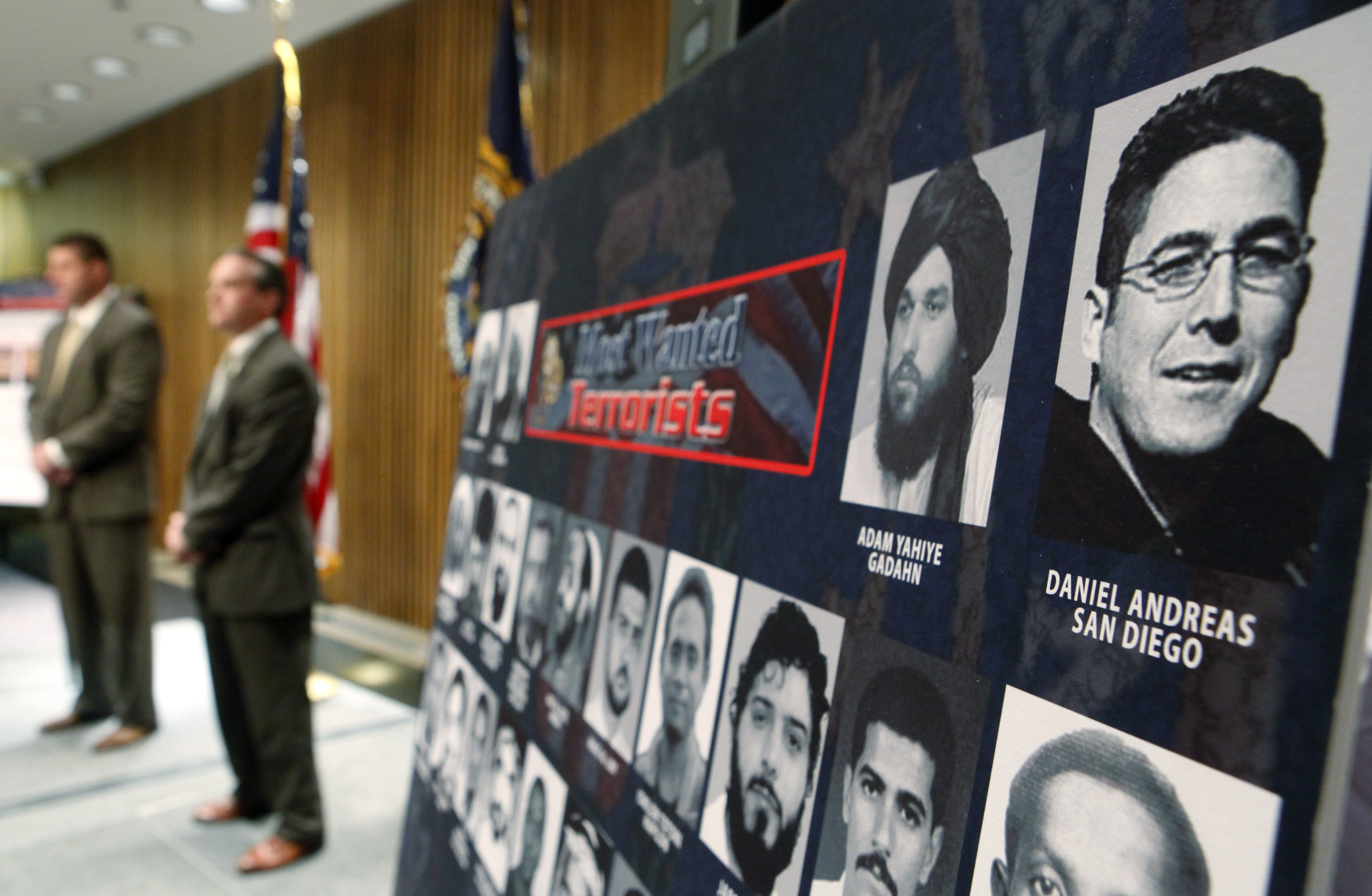 FILE - A photo of Daniel Andreas San Diego, top right, appears on a poster of the FBI's most wanted terrorists during a news conference announcing his addition to the most wanted terrorist list, Tuesday, April 21, 2009, at FBI Headquarters in Washington. (AP Photo/Haraz N. Ghanbari, File)