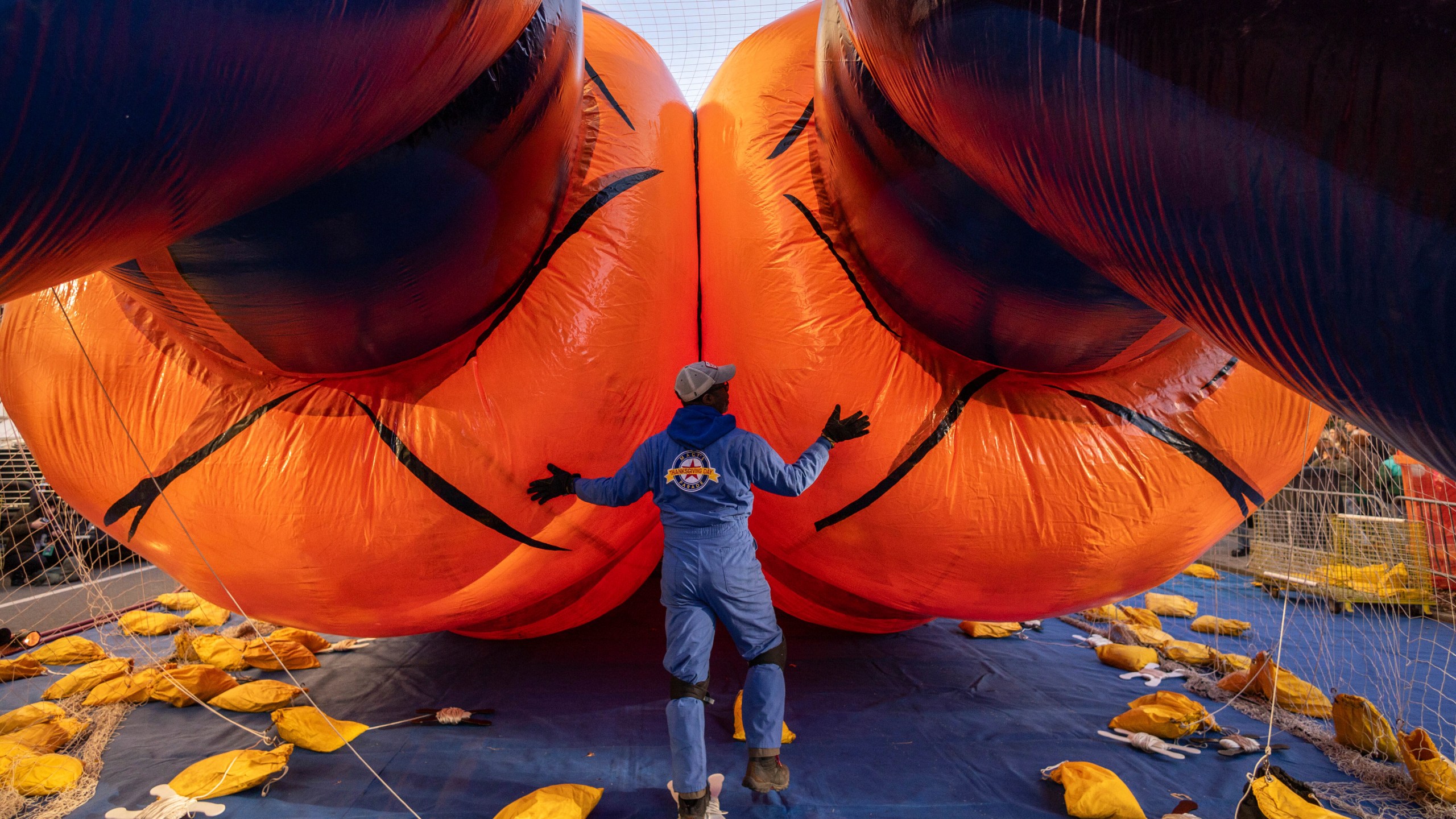 A person inflates a float of Goku in preparation for the Macy's Thanksgiving Day Parade, Wednesday, Nov. 27, 2024, in New York. (AP Photo/Yuki Iwamura)