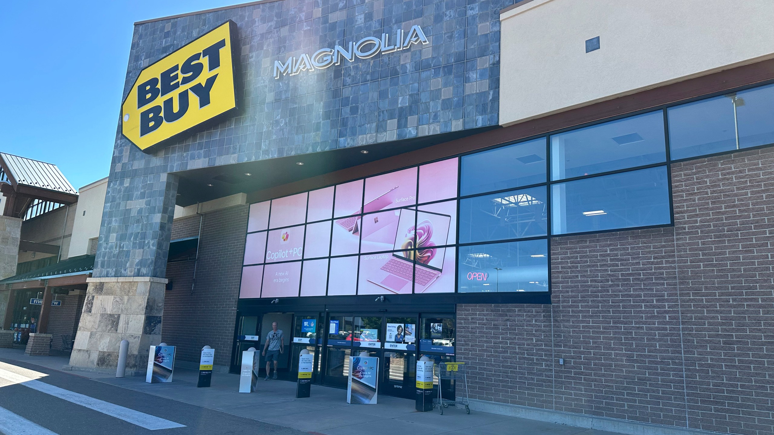 FILE - A shopper exits a Best Buy store on Sept. 19, 2024, in Lone Tree, Colo. (AP Photo/David Zalubowski, File)