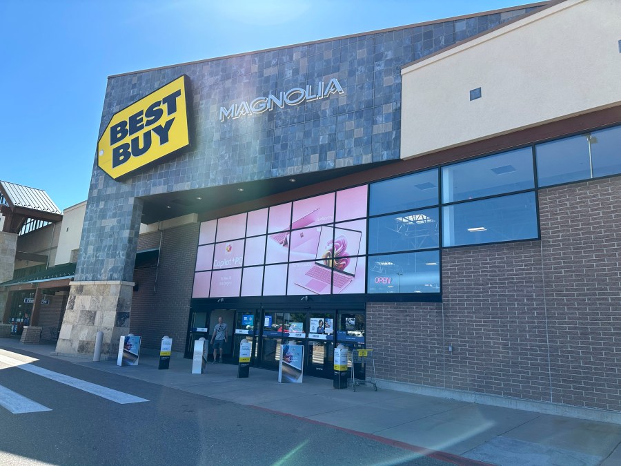 FILE - A shopper exits a Best Buy store on Sept. 19, 2024, in Lone Tree, Colo. (AP Photo/David Zalubowski, File)