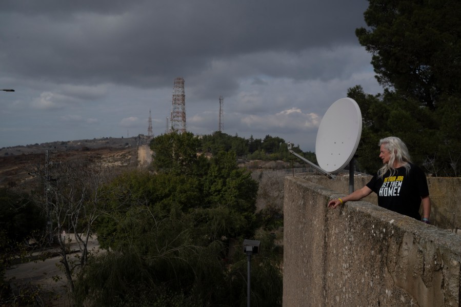 CORRECTS SURNAME.- Orna Weinberg looks at the direction of the Israeli-Lebanese border as she stands on a building in the Kibbutz Manara, northern Israel, Thursday, Nov. 28, 2024. (AP Photo/Leo Correa)