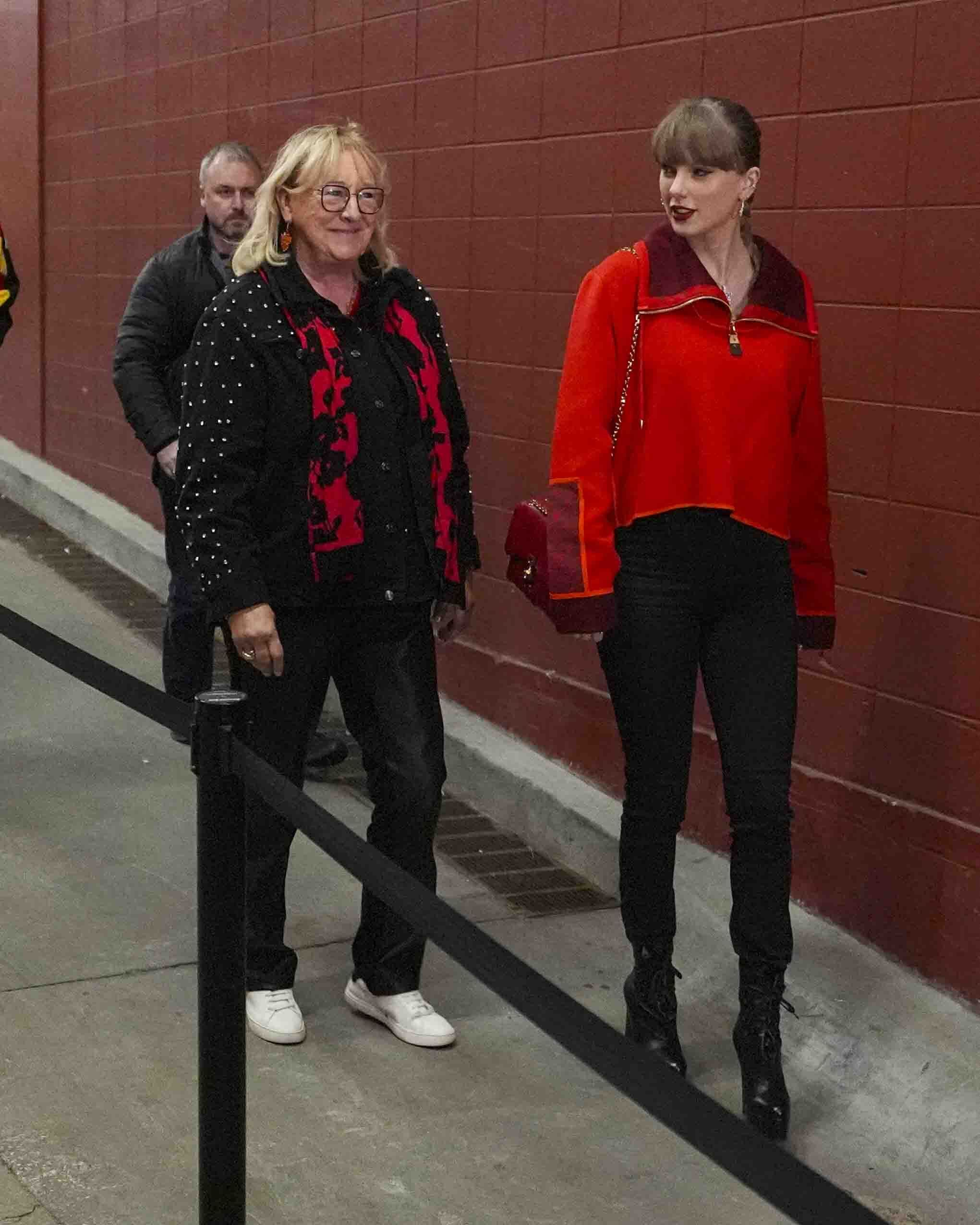 Singer Taylor Swift, right, and Donna Kelce arrive before the start of an NFL football game between the Las Vegas Raiders and the Kansas City Chiefs in Kansas City, Mo., Friday, Nov. 29, 2024. (AP Photo/Charlie Riedel)