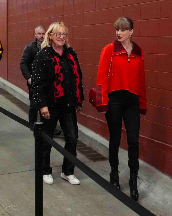 Singer Taylor Swift, right, and Donna Kelce arrive before the start of an NFL football game between the Las Vegas Raiders and the Kansas City Chiefs in Kansas City, Mo., Friday, Nov. 29, 2024. (AP Photo/Charlie Riedel)