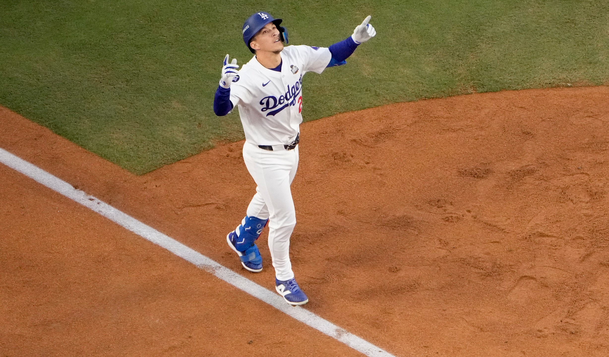 FILE - Los Angeles Dodgers' Tommy Edman celebrates as he reaches home plate after his solo home run during the second inning in Game 2 of the baseball World Series against the New York Yankees, Oct. 26, 2024, in Los Angeles. (AP Photo/Mark J. Terrill, File)