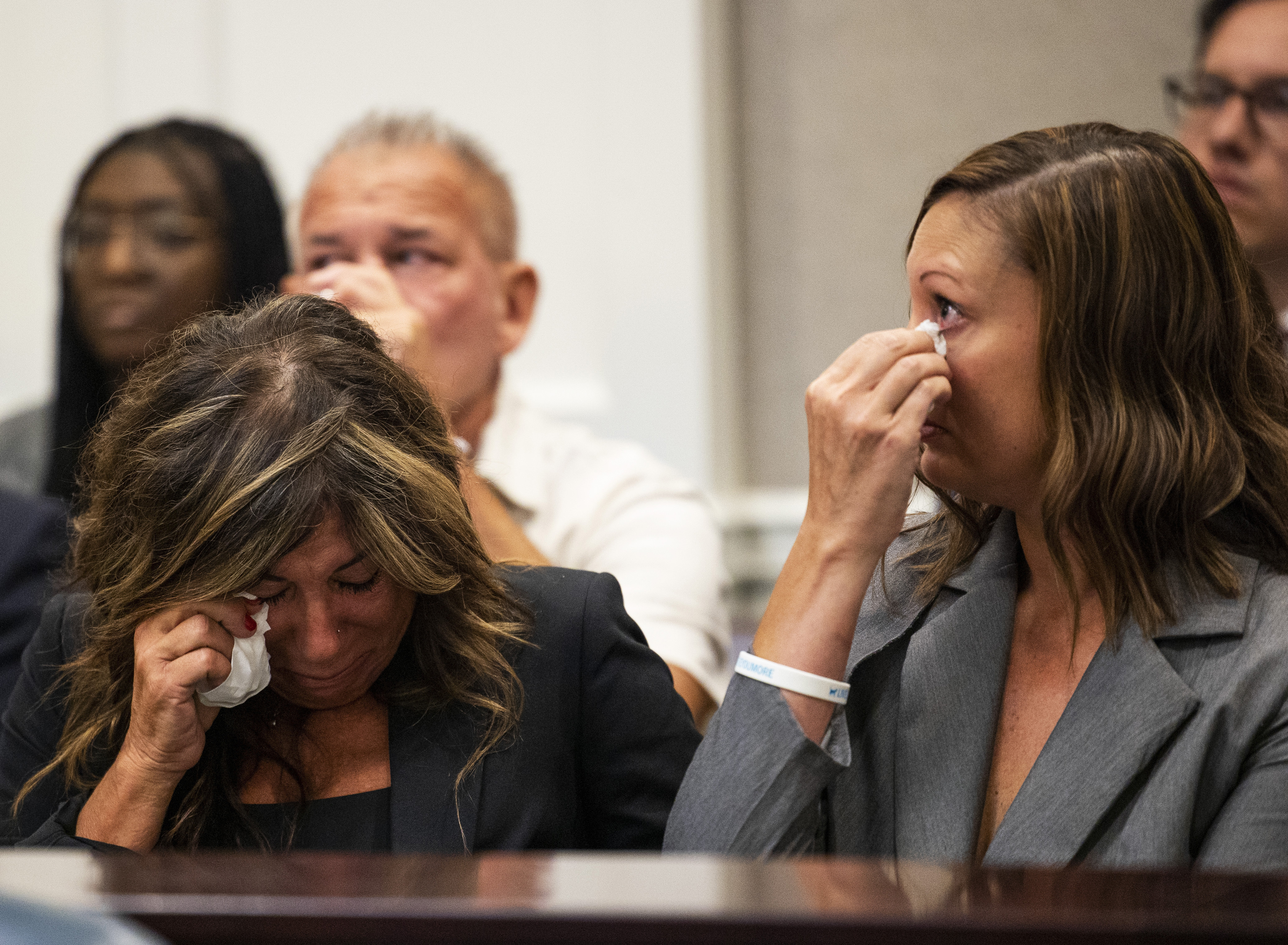 FILE - Lisa Miller, left, and her daughter, Mandi Jenkins, wipe tears from their eyes after testifying during a bond hearing for Jamie Lee Komoroski, Aug 1, 2023, at the Charleston County Courthouse in Charleston, S.C. (Gavin McIntyre/The Post And Courier via AP, File)