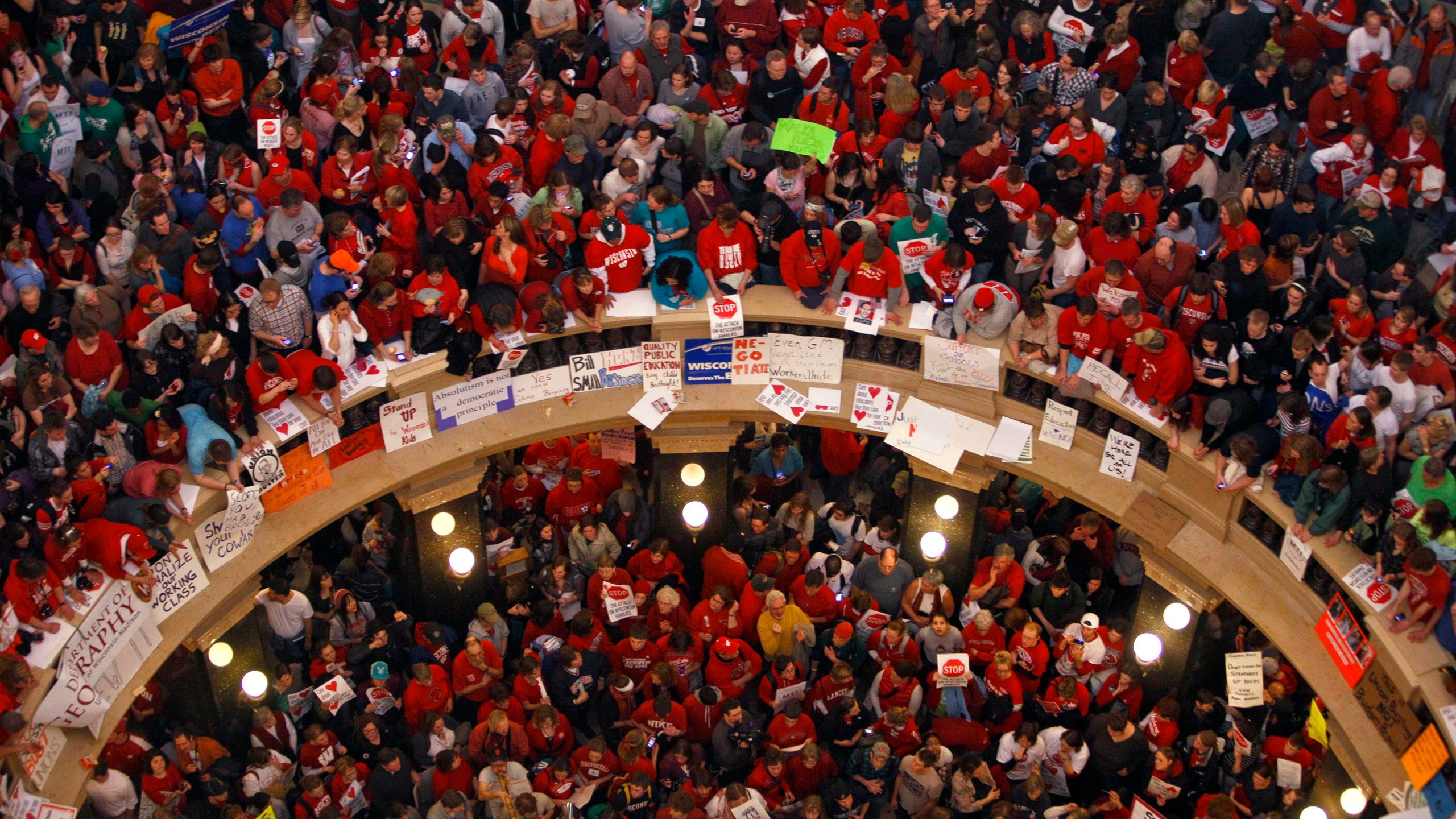 FILE - This file photo taken Feb. 17, 2011 shows protestors of Wisconsin Gov. Scott Walker's bill to eliminate collective bargaining rights for many state workers packing the rotunda at the State Capitol in Madison, Wis. (AP Photo/Andy Manis, File)