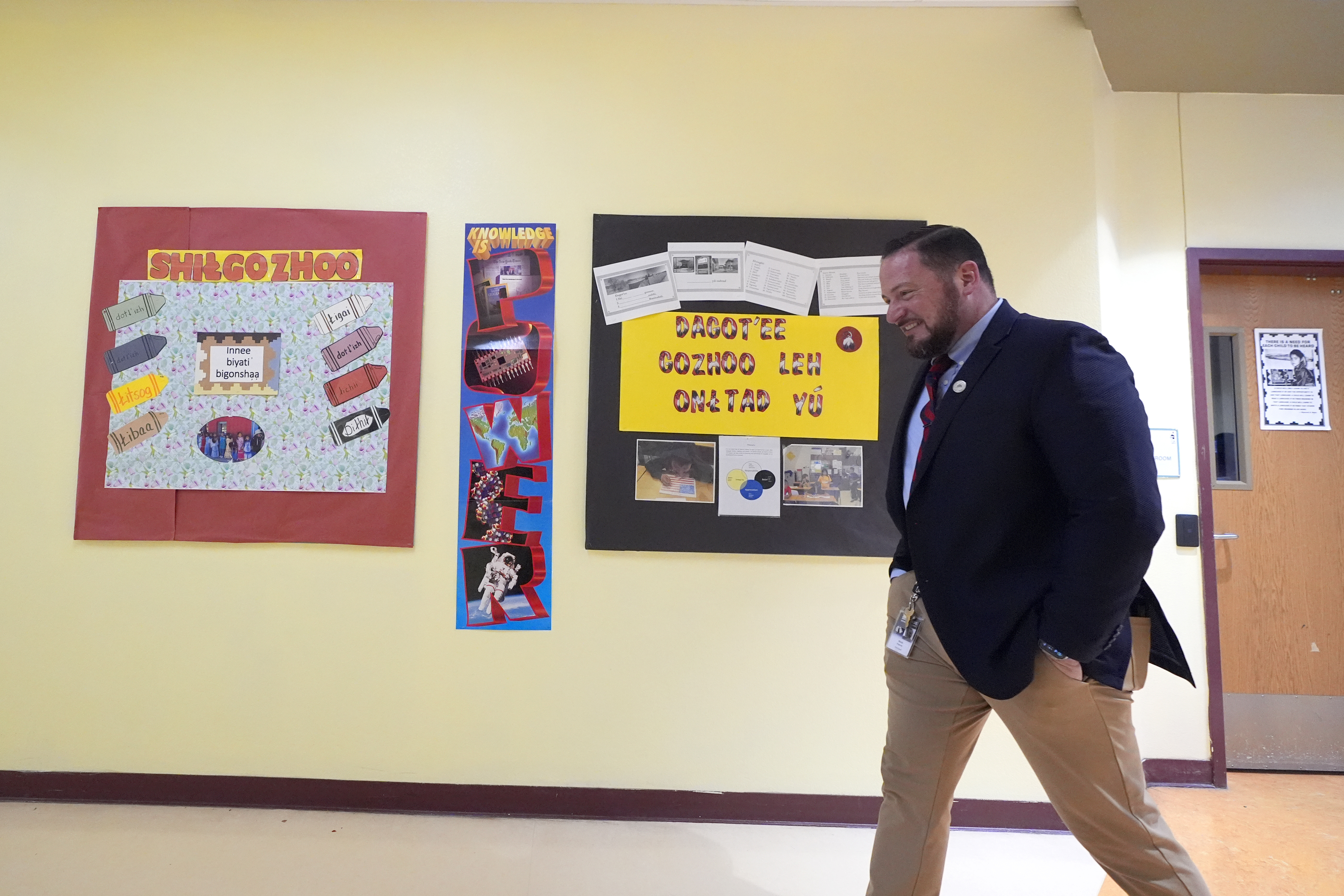 Rice Intermediate School Principal Nicholas Ferro walks to a classroom at Rice Intermediate School Tuesday, Aug. 27, 2024, in San Carlos, Ariz. (AP Photo/Ross D. Franklin)