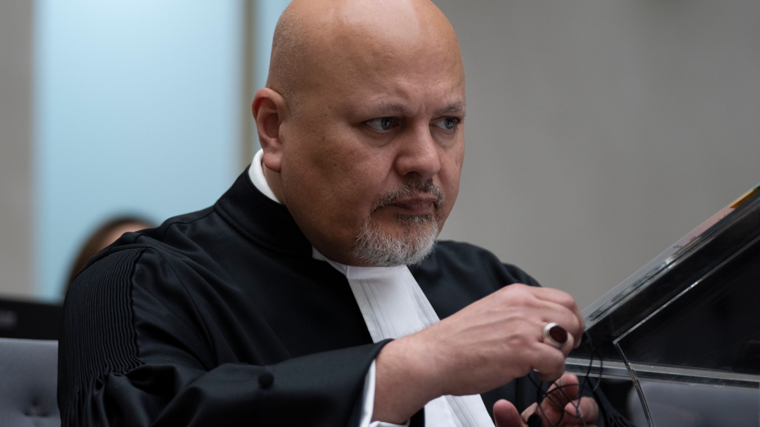 FILE - Public Prosecutor Karim Khan prepares for the trial of Mahamat Said Abdel Kani at the International Criminal Court in The Hague, Netherlands, Sept. 26, 2022. (AP Photo/Peter Dejong, Pool, File)