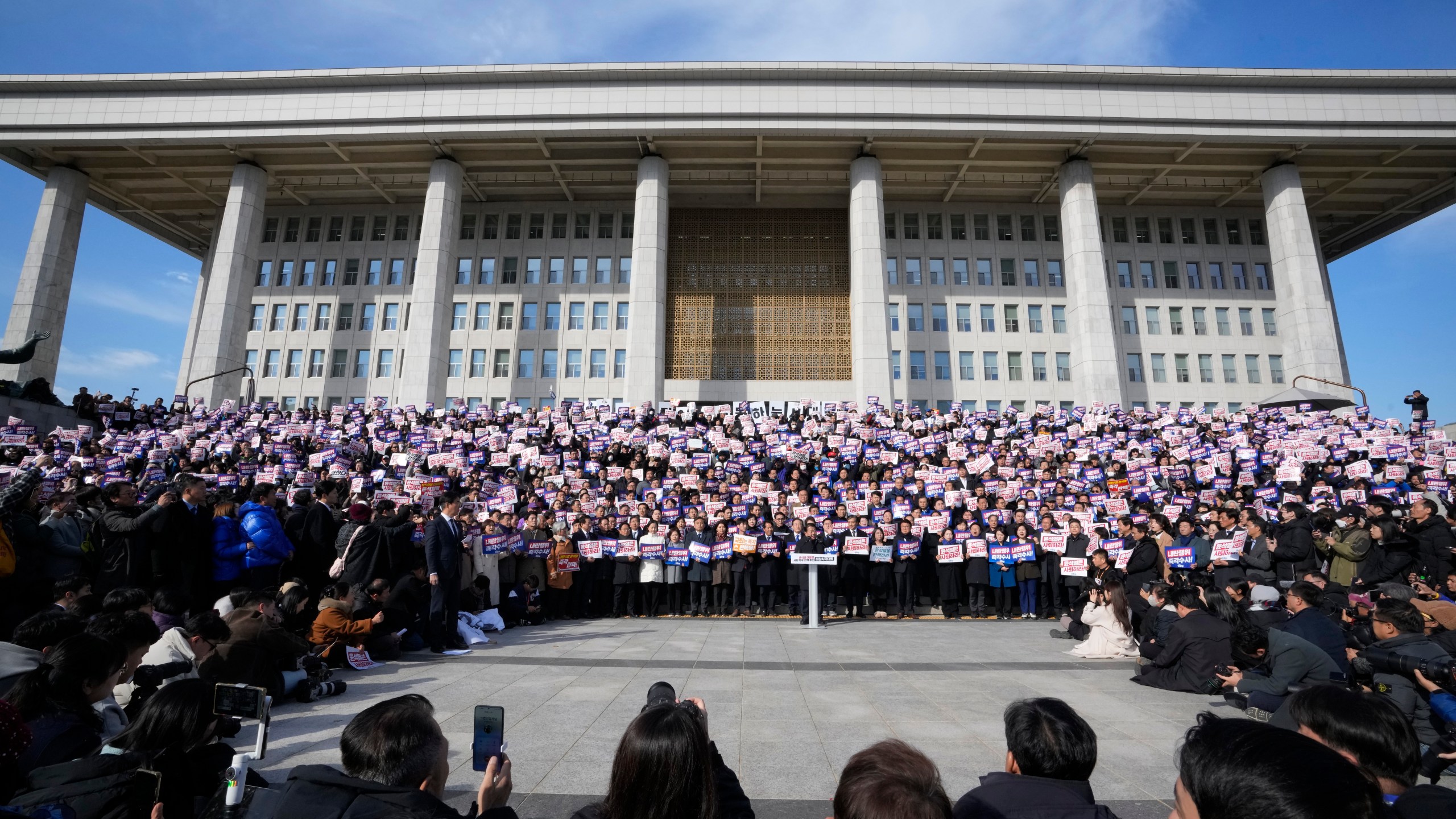 Members of main opposition Democratic Party stage a rally against South Korean President Yoon Suk Yeol at the National Assembly in Seoul, South Korea, Wednesday, Dec. 4, 2024. (AP Photo/Ahn Young-joon)