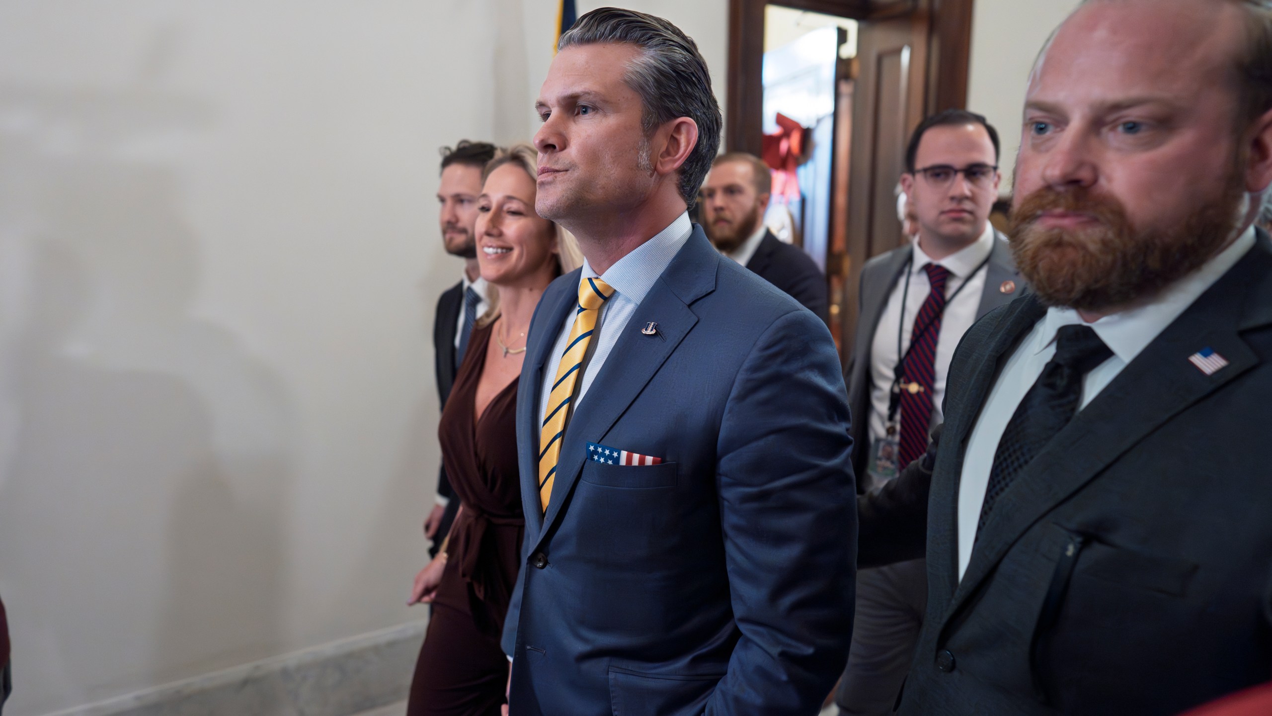 Pete Hegseth, President-elect Donald Trump's nominee to be defense secretary, is joined by his wife Jennifer Rauchet, left, as they arrive to meet with Sen. Ted Budd, R-N.C., a member of the Senate Armed Services Committee, at the Capitol in Washington, Tuesday, Dec. 3, 2024. (AP Photo/J. Scott Applewhite)