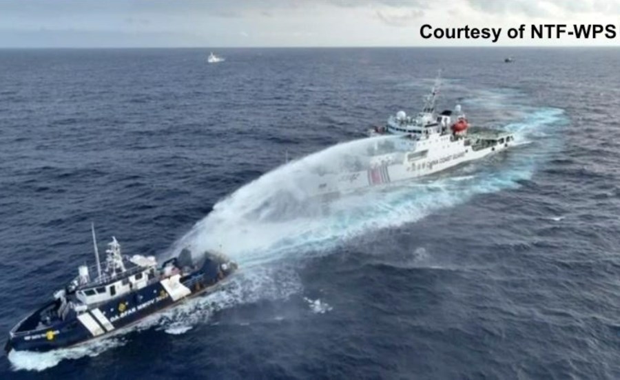 In this image taken from a video provided by National Task Force for the West Philippine Sea (NTF-WPS), a Chinese coast guard vessel, right, fires a powerful water cannon on a Philippine bureau of fisheries vessel near a disputed shoal in the South China Sea Wednesday, Dec. 4, 2024. (NTF-WPS via AP)