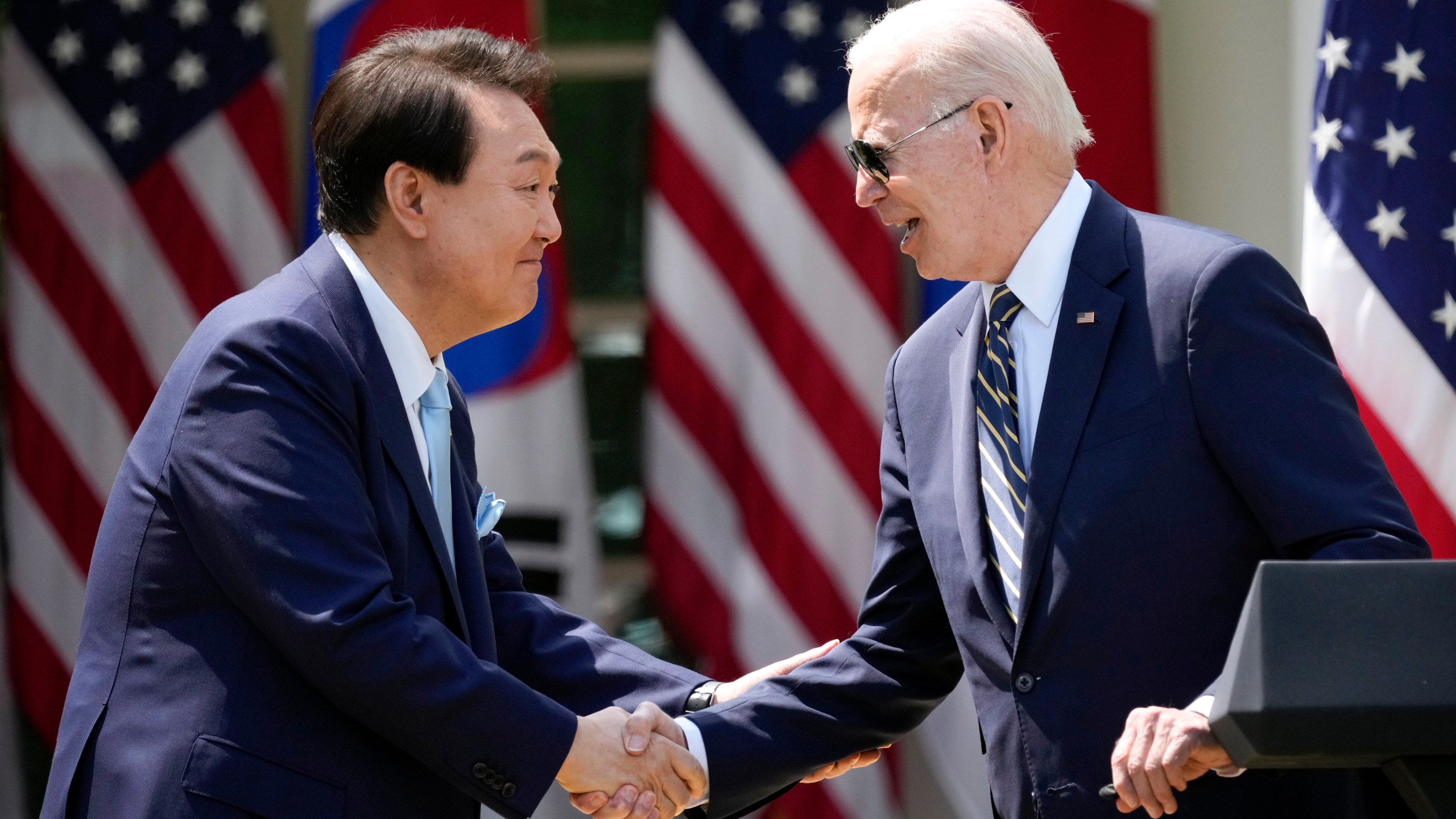 FILE - President Joe Biden, right, and South Korea's President Yoon Suk Yeol shake hands during a news conference in the Rose Garden of the White House, April 26, 2023, in Washington. (AP Photo/Andrew Harnik, File)