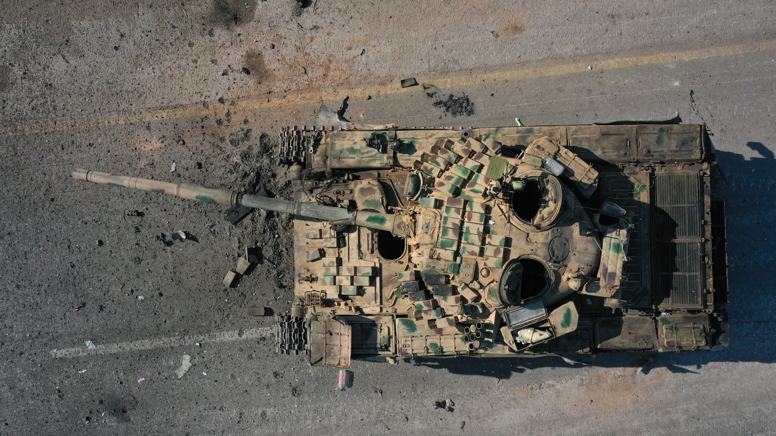 An abandoned Syrian army armoured vehicle sits on a road controlled by Syrian insurgents in the outskirts of Hama, Syria, Tuesday Dec. 3, 2024.(AP Photo/Ghaith Alsayed)