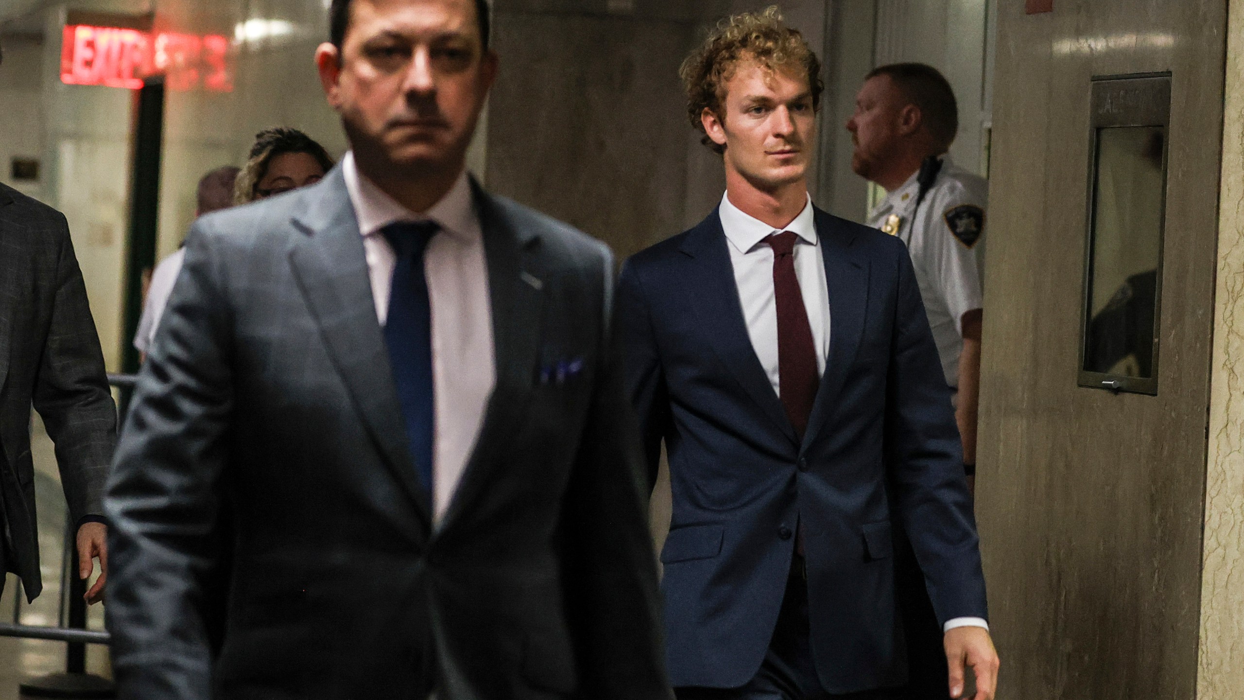 Daniel Penny, right, walks out of the courtroom, next to Thomas Kenniff, left, his lawyer, Wednesday, Dec. 4, 2024, in New York. (AP Photo/Heather Khalifa)