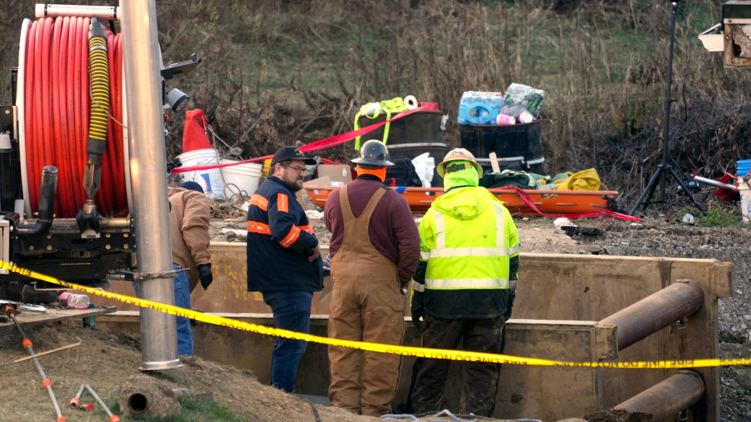 Rescue workers continue to search, Wednesday, Dec. 4, 2024, for Elizabeth Pollard, who is believed to have disappeared in a sinkhole while looking for her cat, in Marguerite, Pa. (AP Photo/Gene J. Puskar)