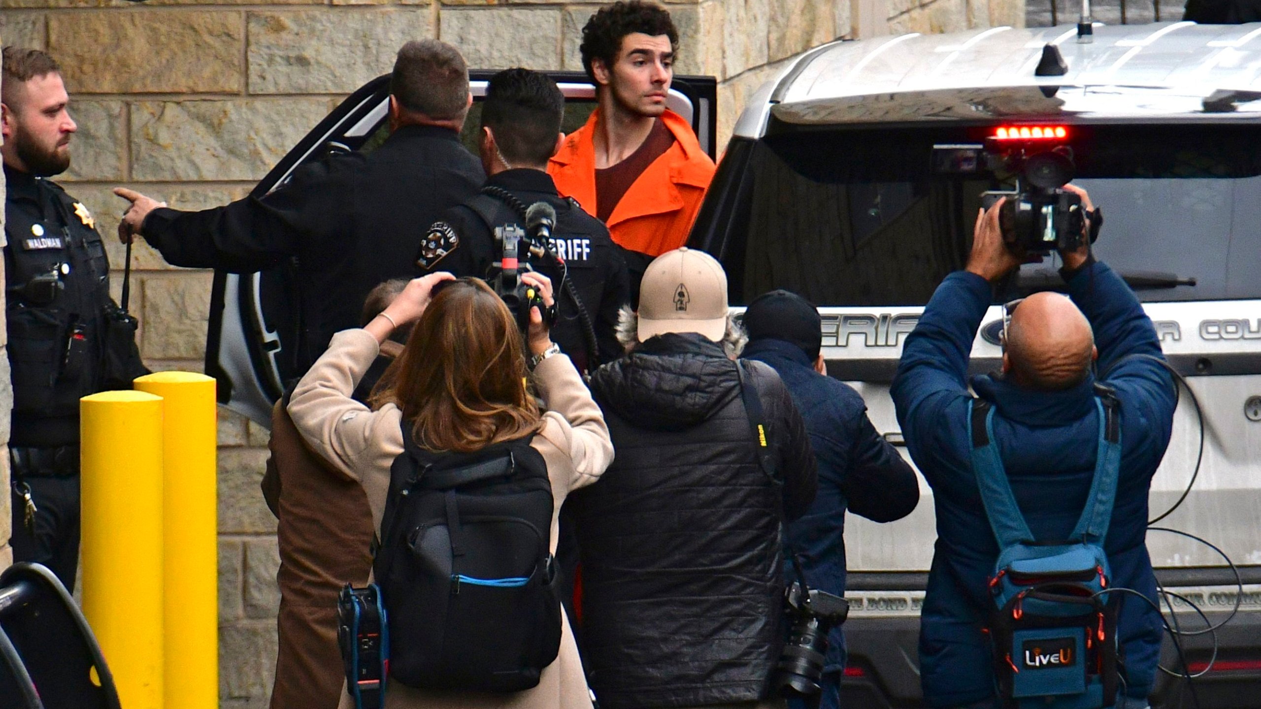 Suspect Luigi Mangione is taken into the Blair County Courthouse on Tuesday, Dec. 10, 2024, in Hollidaysburg, Pa. (Janet Klingbeil via AP)