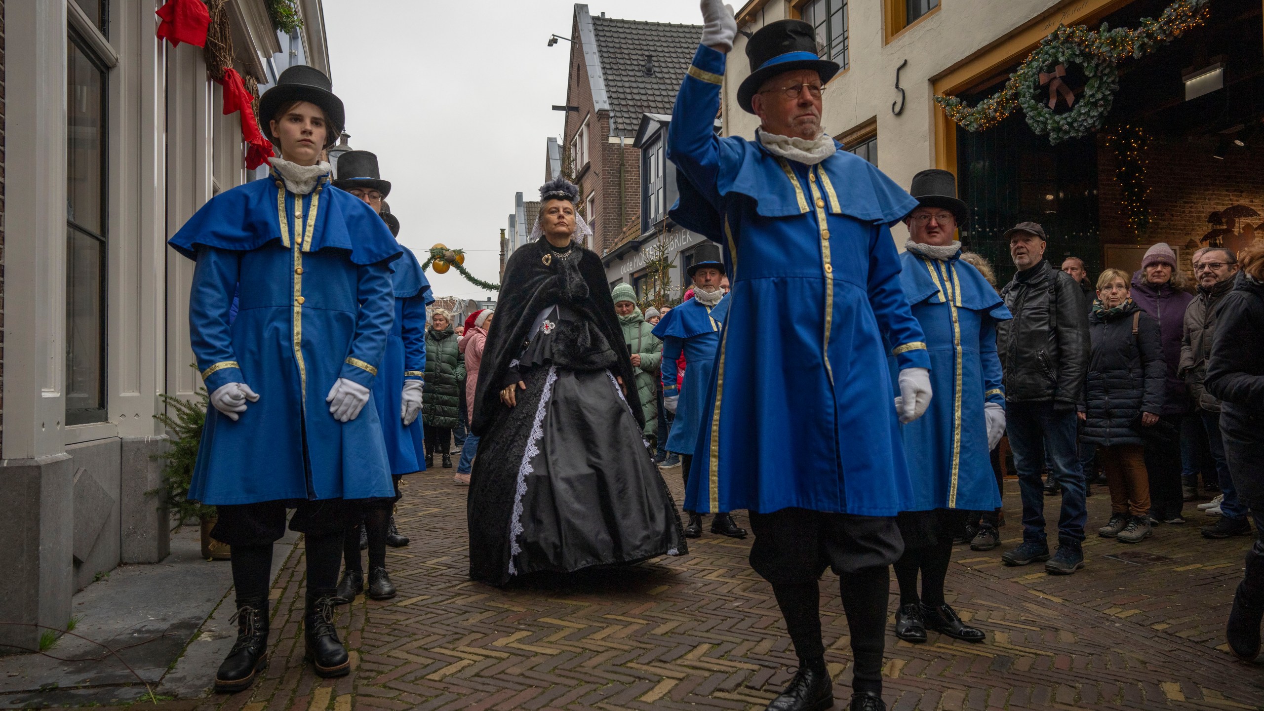 Sandra Nieland plays Queen Victoria a people in costumes from Charles Dickens' 19th-century English era take part in a Dickens Festival, in Deventer, Netherlands, Saturday, Dec. 14, 2024. (AP Photo/Peter Dejong)