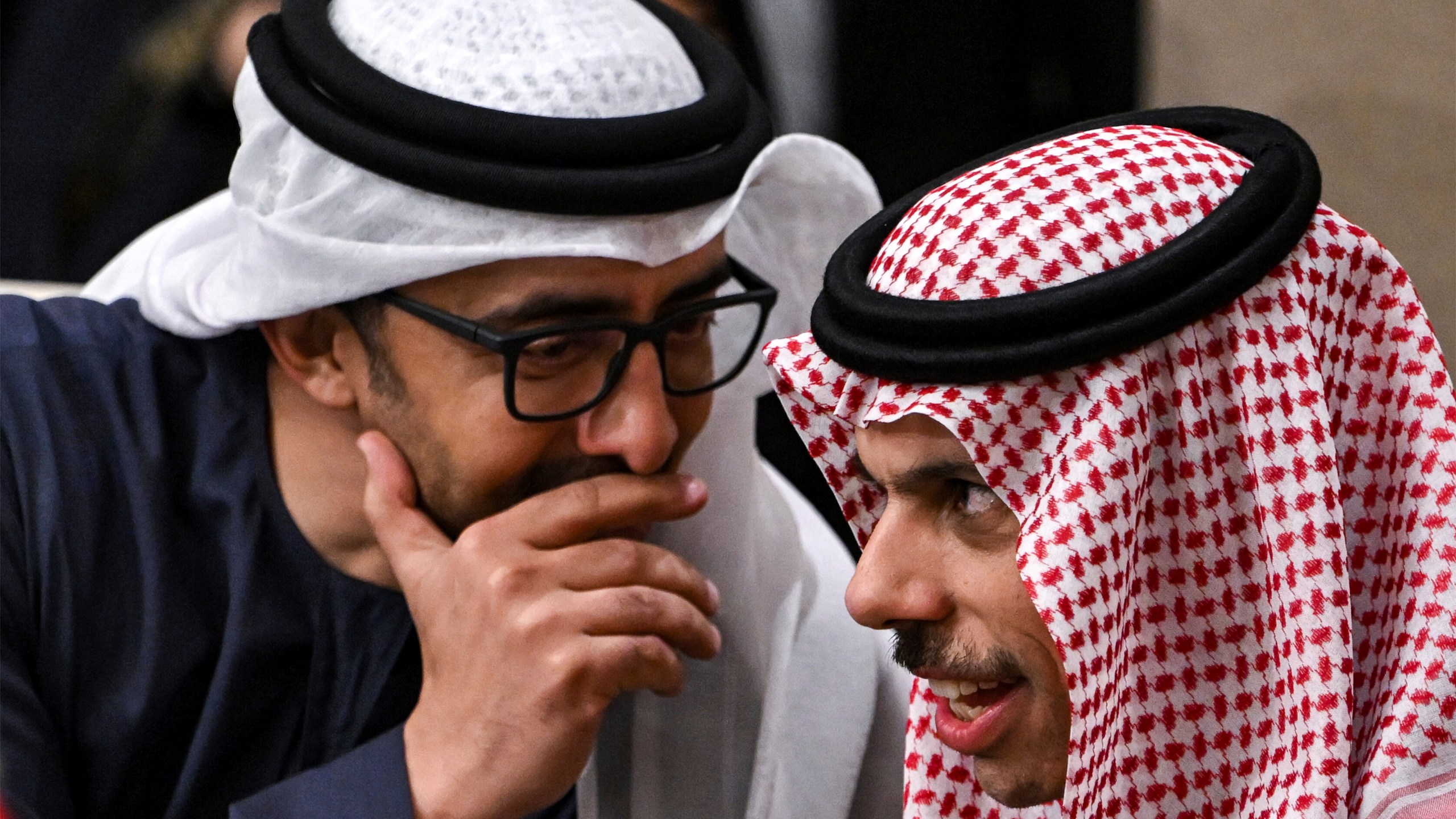 The UAE's Foreign Minister Sheikh Abdullah bin Zayed al-Nahyan, left, speaks with Saudi Arabia's Foreign Minister Prince Faisal bin Farhan al-Saud during a meeting with the foreign ministers of the Arab Contact Group on Syria in Jordan's southern Red Sea coastal city of Aqaba, Saturday Dec. 14, 2024. (Andrew Caballero-Reynolds/Pool via AP)