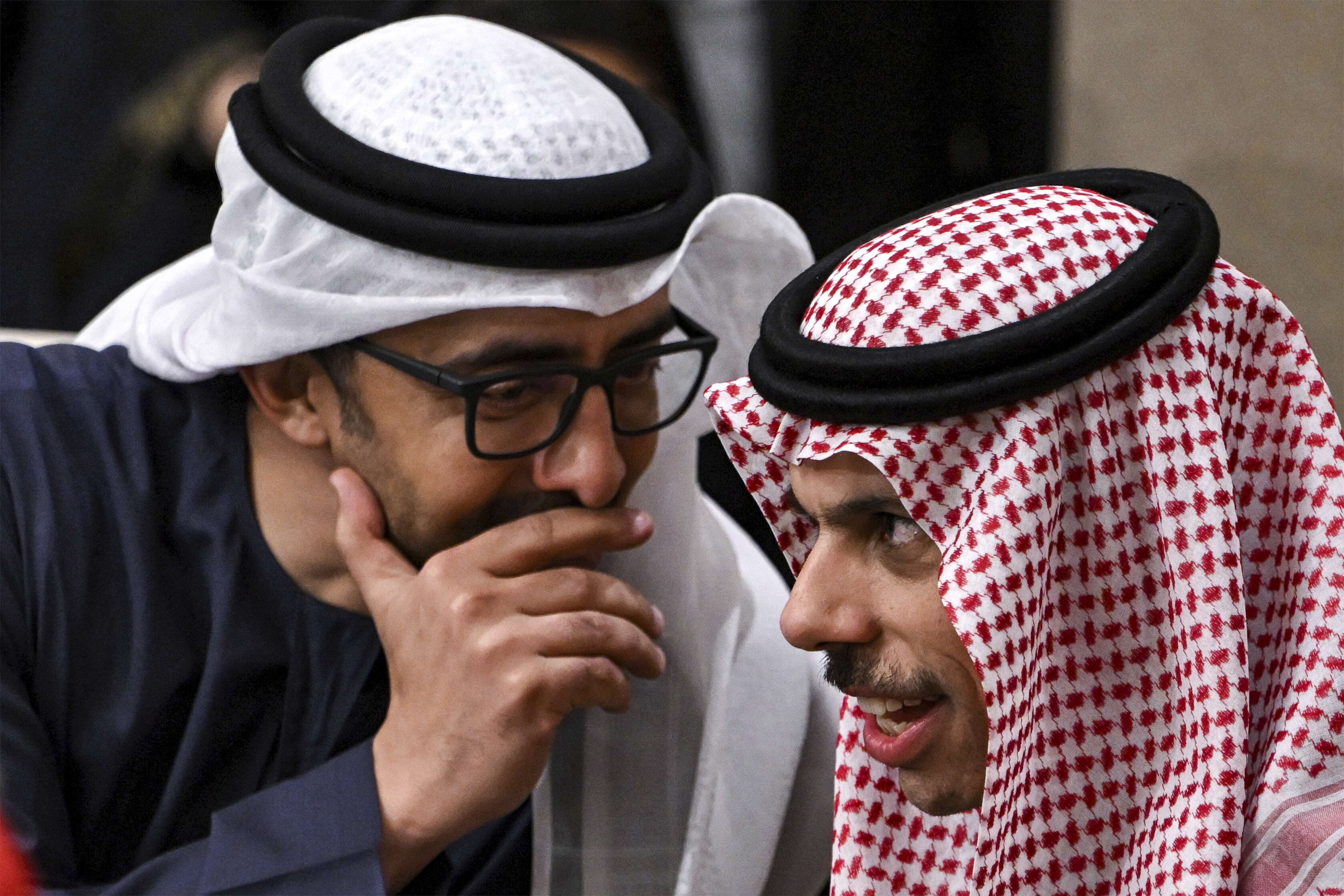 The UAE's Foreign Minister Sheikh Abdullah bin Zayed al-Nahyan, left, speaks with Saudi Arabia's Foreign Minister Prince Faisal bin Farhan al-Saud during a meeting with the foreign ministers of the Arab Contact Group on Syria in Jordan's southern Red Sea coastal city of Aqaba, Saturday Dec. 14, 2024. (Andrew Caballero-Reynolds/Pool via AP)