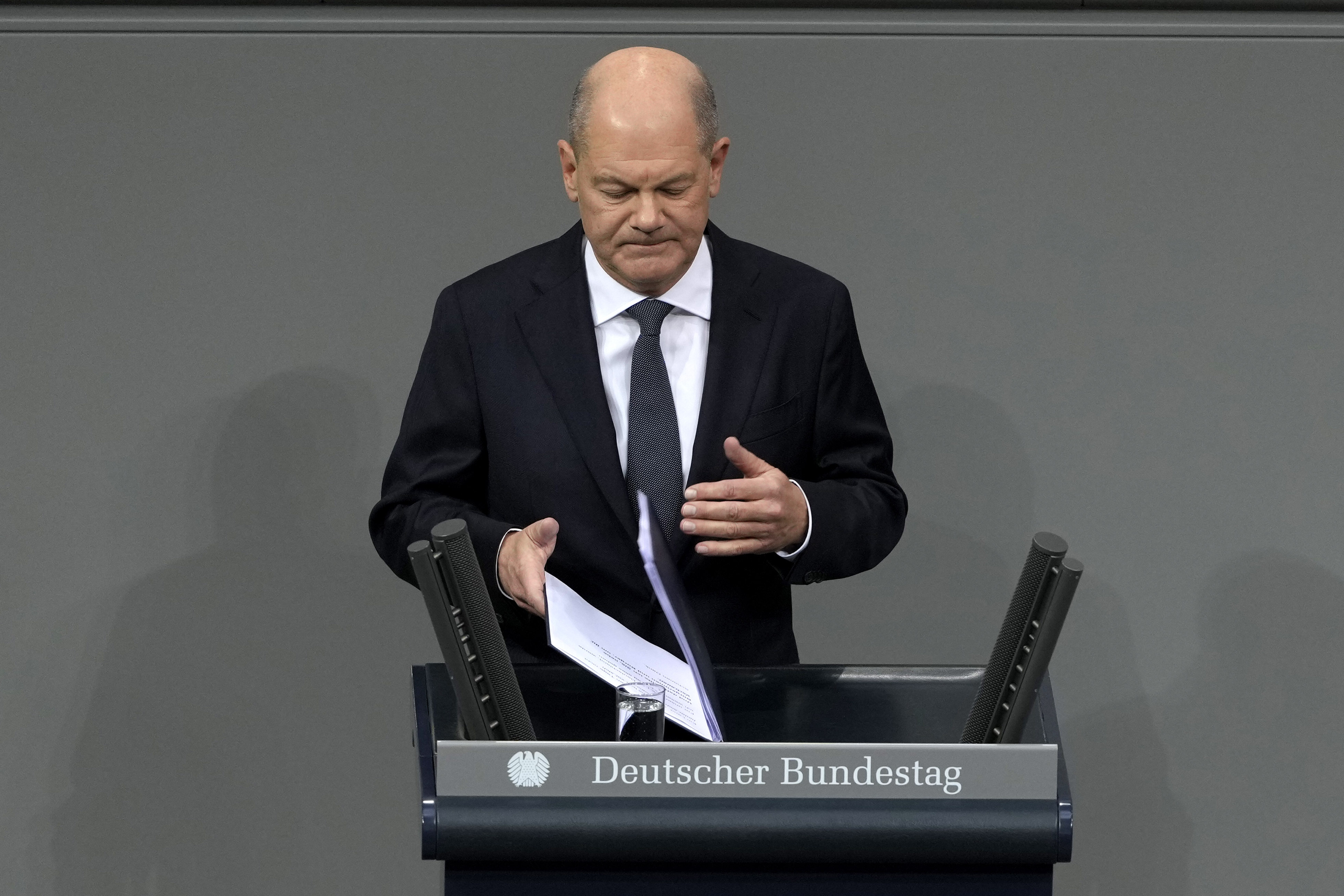 German Chancellor Olaf Scholz speaks during a plenary session at the German parliament Bundestag where he faces a vote of confidence, Berlin, Germany, Monday, Dec. 16, 2024. (AP Photo/Markus Schreiber)