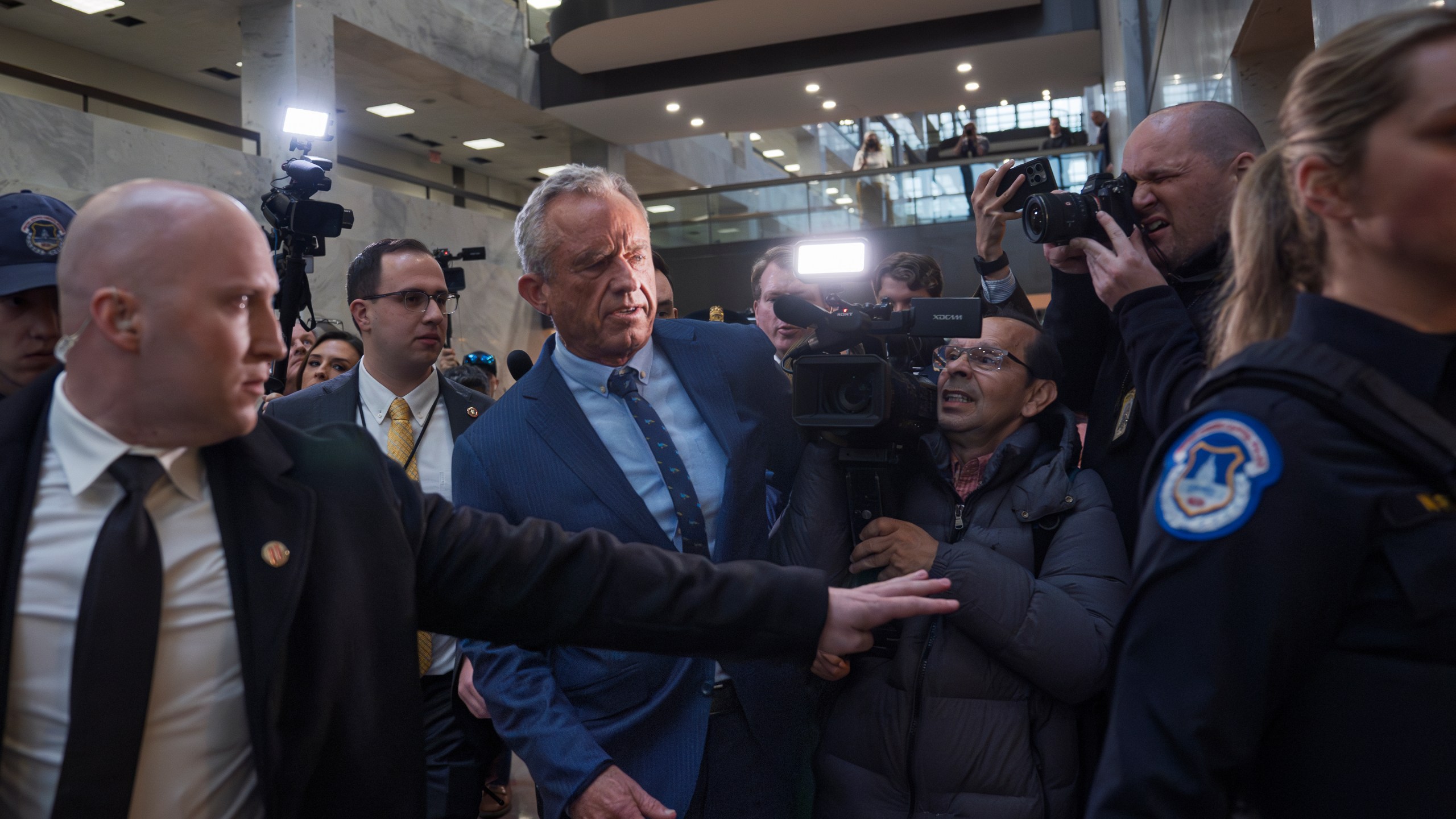 Robert F. Kennedy Jr., President-elect Donald Trump's nominee to be Secretary of Health and Human Services, arrives at the Hart Building to meet with senators at the Capitol in Washington, Monday, Dec. 16, 2024. (AP Photo/J. Scott Applewhite)