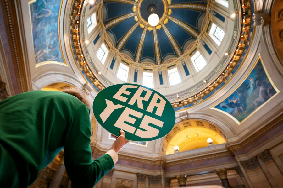 FILE - ERA YES sign in the State Capitol Rotunda during a rally for the Equal Rights Amendment, Jan. 31, 2022 in St. Paul, Minn. (Glen Stubbe/Star Tribune via AP, File)